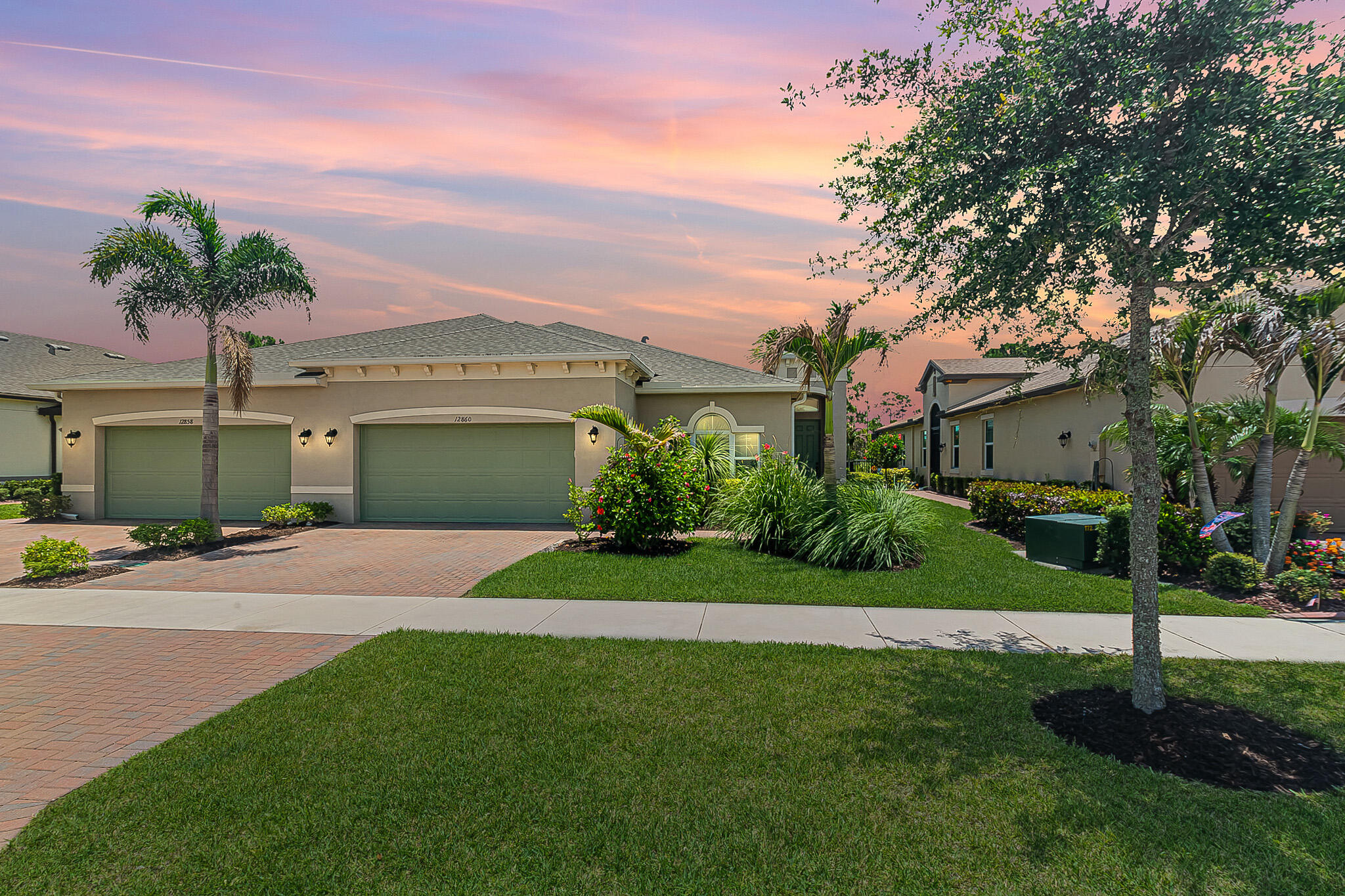 Picture-perfect villa living awaits in Lake Park at Tradition! This 2/2/2 home features a versatile flex room with a bright, open layout that is beautifully complemented by plantation shutters, tray ceilings, and wood-look tile throughout. A chef-inspired kitchen boasts quartz counters and stainless appliances, pantry. Step outside to your private oasis: an extended, screened paver patio and fully fenced backyard. Complete with impact glass for peace of mind. Active 55+ gated community with resort-style amenities including a clubhouse, fitness center, pools, dog park, and sports courts, more!