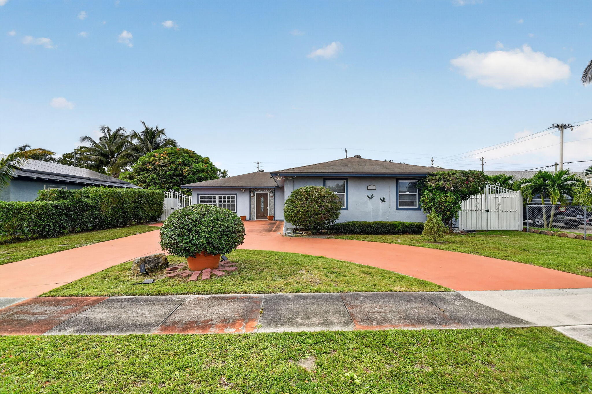 Welcome to Greenbrier! No HOA, no restrictions, and no compromises on space. This 5-bedroom, 2-bath home in a quiet Lake Worth Beach neighborhood offers 1,924 sq ft of flexible living space at an unbeatable price point. The enclosed garage adds extra square footage, perfect if you need more space! Updated throughout and move-in ready. Bring your boat, your RV, and your vision...this one checks the boxes that are getting harder to find in Palm Beach County.