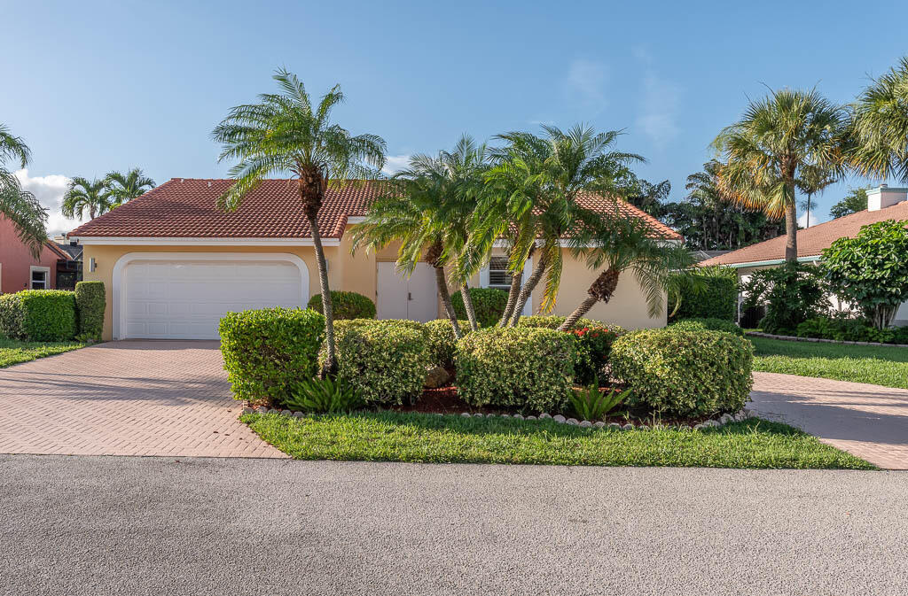 Welcome to this beautifully updated single-story home in the gated community of Boca Lake Estates, ideally located in East Boca Raton just minutes from the beach, premier dining, shopping, and entertainment. Offering 3 bedrooms, 2 bathrooms, and a thoughtfully designed open floor plan, this home is perfect for both everyday living and entertaining. Custom French doors open to a bright interior with beautiful views of the private pool and tranquil waterfall, creating a seamless indoor-outdoor living experience. The home features granite countertops, newer appliances, a newer roof, and tile flooring throughout. A spacious two-car garage adds convenience, while the sought-after location and private community make this an exceptional opportunity to enjoy the best of the Boca Raton lifestyle.