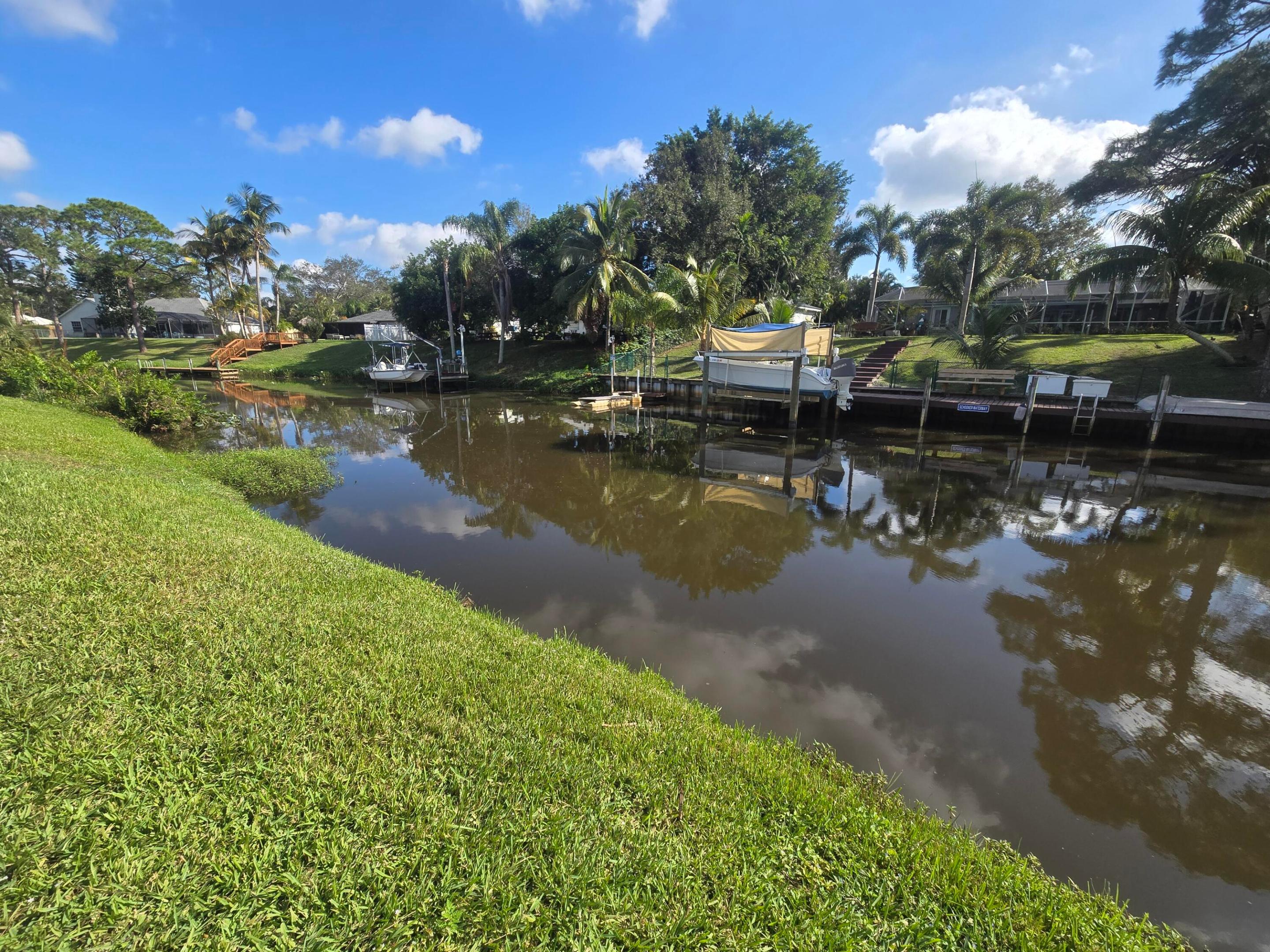Own Your Slice of Paradise! Ocean Access Lot in Port St. Lucie!  Don't miss the chance to own this High & Dry, OCEAN ACCESS waterfront lot in Port St. Lucie! This lot is already cleared, and is the perfect canvas to build your dream home. Imagine a luxurious, peaceful waterfront property, tucked into a neighborhood of lovely homes. Add a pool, dock, cabana... with no HOA restrictions, you have the freedom to bring your vision to life without limitations. Whether you're seeking a relaxing getaway or an entertainer's paradise, the possibilities are endless!  Approx 40 minutes via boat to the ocean. Take the first step towards owning a piece of paradise. **Seller Motivated**