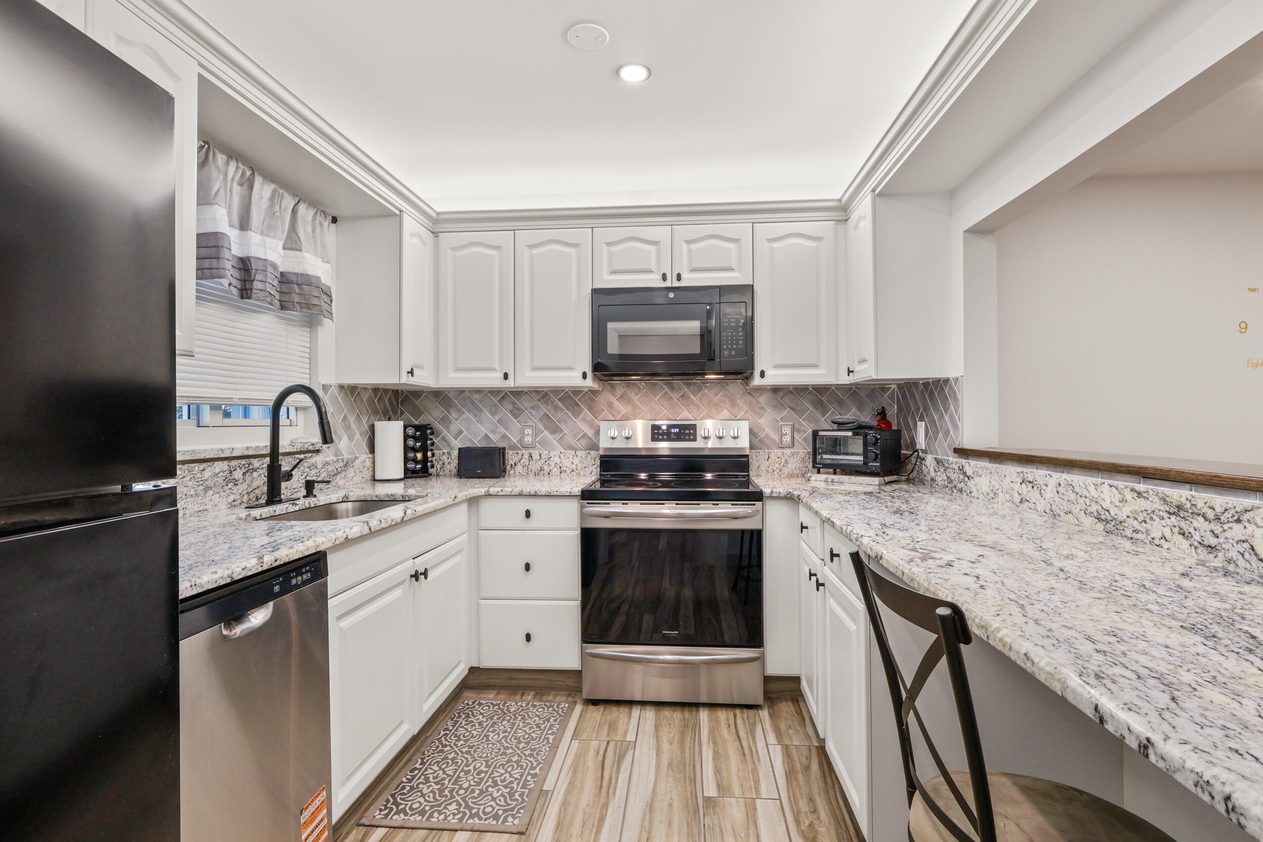 Look no further! This charming, fully furnished 2-bedroom, 2-bathroom condo  located on the second floor in a 55+ community and has been recently renovated for comfortable Florida living. Beautiful ceramic tile flooring runs throughout the home, while abundant natural light creates a bright, spacious, and inviting atmosphere. The updated kitchen features modern appliances and granite countertops, opening seamlessly to the living area and keeping you connected with your guests. Residents can enjoy the community pool and BBQ grilling area—perfect for relaxing and enjoying the outdoors. Conveniently located within walking distance of local shops and restaurants, this condo is also just minutes from downtown Stuart, beaches, and golf course. FIRST AND SECURITY to move in! Set your tour today!