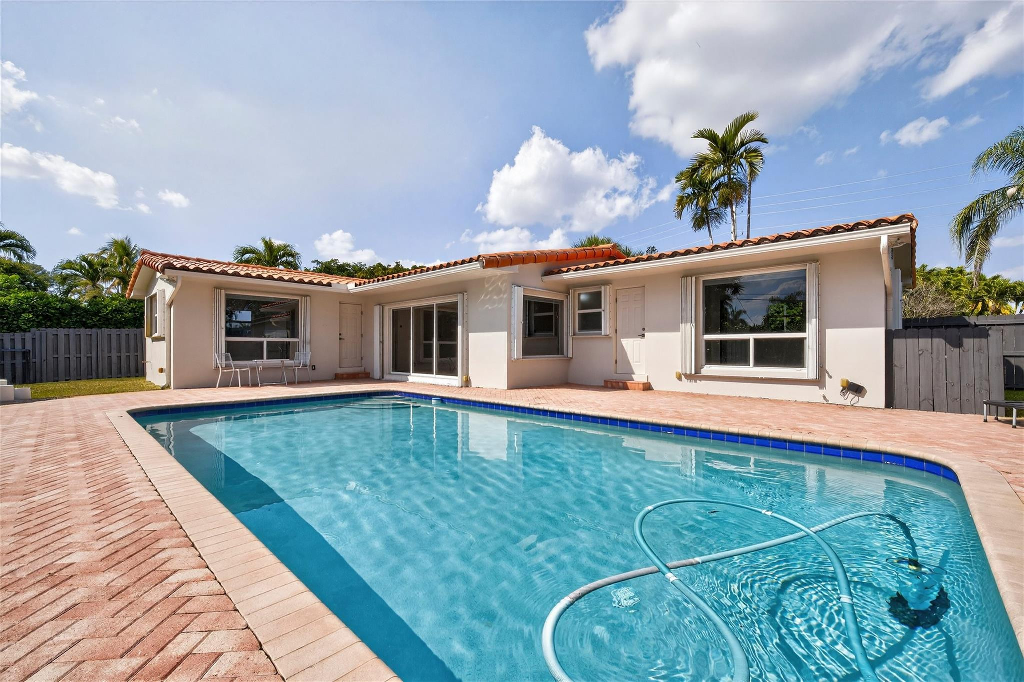 What a great home situated on a large lot with oversize pool, ideally located in most desirable Coral Heights area, Oakland Park. All updated, new flooring, kitchen, new appliances and counter tops, full size washer and dryer. split bedrooms, updated modern baths, custom walk in Cedar closet. Entire home just painted, two car carport can easily be closed in. Totally fenced om with lots of room entertain and play.  Short distance to restaurants, shops and the beaches, this home has full Hurricane protection.  Roof is 11 years old. AC 18 months. Nothing to do, just enjoy the Florida sunshine!!  Easy to show