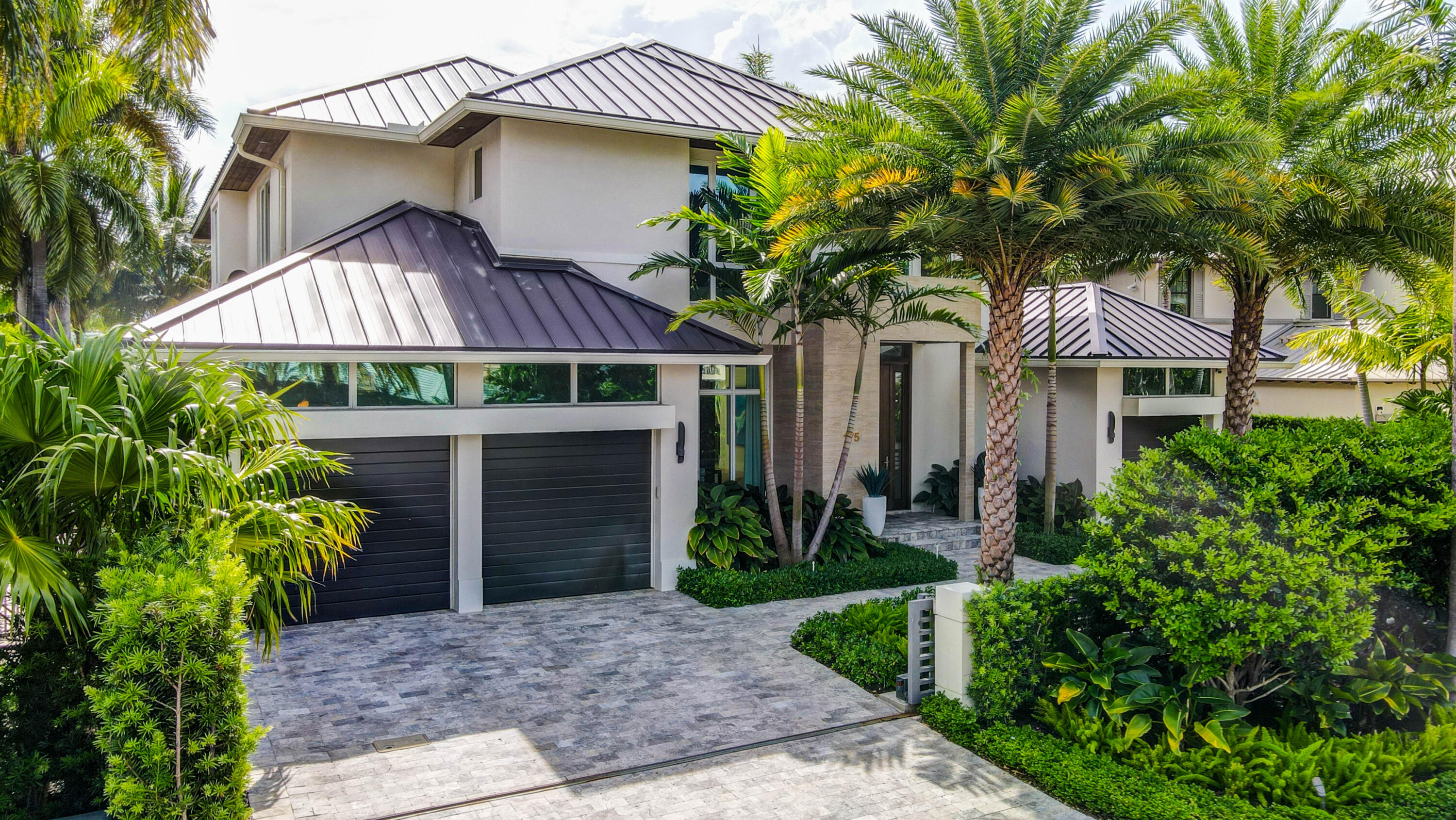 Modern deepwater Las Olas Isles home with striking architecture, sophisticated floor plan and finishes, and water views from all main living areas. Features include a 250 bottle wine room, chef's kitchen with center island, Thermador appliances, great room, living room, formal dining room, theater room with wet bar, gas fireplace, elevator, and laundry rooms both upstairs and down. The second floor features a spectacular primary suite with a private balcony, 4 junior suites (one first floor) with oversized en-suite baths, and a large upstairs lounge. The amazing outdoor area includes an outdoor kitchen, pool with spa, covered lanai with powered drop down screens, and a putting green. A Crestron smart home system controls lighting, sound, shades and pool. This home offers 85' on the water with no fixed bridges, offering quick and easy access to the inlet. The lush landscaping and gated entrance enhances the property's privacy and security. This house has been impeccably maintained and is available fully furnished for an additional cost. 
DISCLAIMER: Information published or otherwise provided by the listing company and its representatives including but not limited to prices, measurements, square footages, lot sizes, calculations, statistics, and videos are deemed reliable but are not guaranteed and are subject to errors, omissions or changes without notice. All such information should be independently verified by any prospective purchaser or seller. Parties should perform their own due diligence to verify such information prior to a sale or listing.