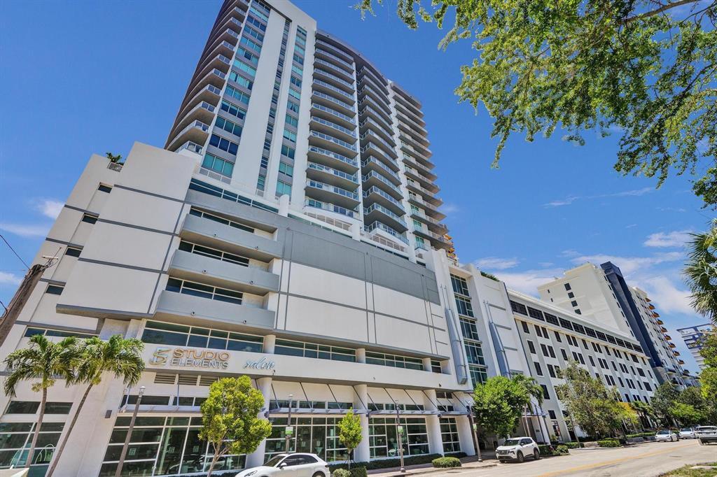 This beautifully recently painted corner unit comes with 2 assigned parking spaces and features 2 beds, 2.5 baths, open-concept living, a modern kitchen, floor-to-ceiling impact glass, high ceilings, and abundant natural light. Enjoy stunning downtown, city, and partial ocean views from the living area. The primary suite offers a large walk-in closet and a spa-style bathroom with double sinks, a soaking tub, and a separate shower. The guest bedroom includes a private bathroom and generous closet space. Prime location—walking distance to Downtown, Las Olas, Flagler Village, Brightline station, restaurants, and shops. Just 15 minutes to FLL Airport and the beach. Pet-friendly building with resort-style amenities: gym, pool with hot tub, clubhouse, business center, 24-hour front desk, EV cha
