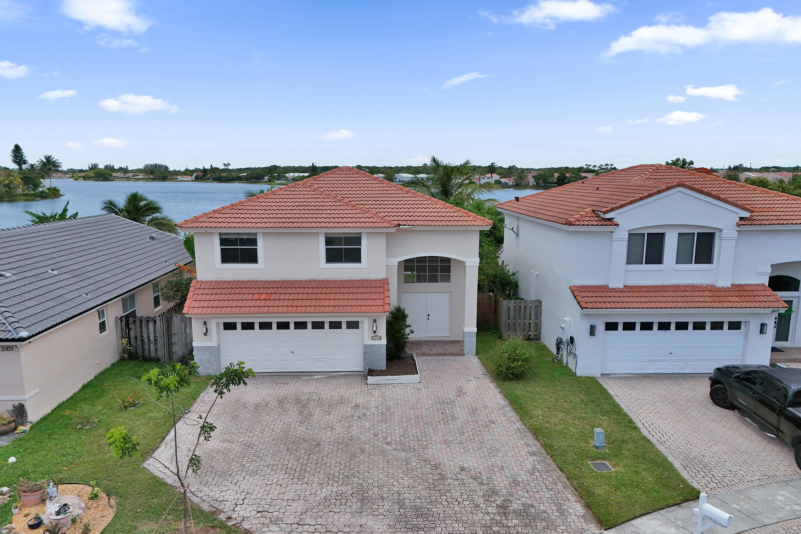 Beautifully Renovated 4-Bedroom, 2-Bathroom Single-Family Home With A 2-Car Garage In The Highly Desirable Coral Bay Community. This Spacious Residence Features Tile Flooring Throughout The Main Living Areas Downstairs And Laminate Wood Flooring Upstairs, Creating A Warm And Modern Feel. The Updated Kitchen Boasts Quartz Countertops, Newer Appliances, And Ample Cabinet Space. Step Outside To A Private Backyard Surrounded By Lush Landscaping, Perfect For Relaxing Or Entertaining. Residents Of Coral Bay Enjoy Resort-Style Amenities, Including Three Community Pools, Basketball Courts, Tennis Courts, And More. Conveniently Located Near Shopping, Dining, Top-Rated Schools, And Major Highways, This Home Also Offers Low HOA Dues And Investor-Friendly Rental Flexibility.