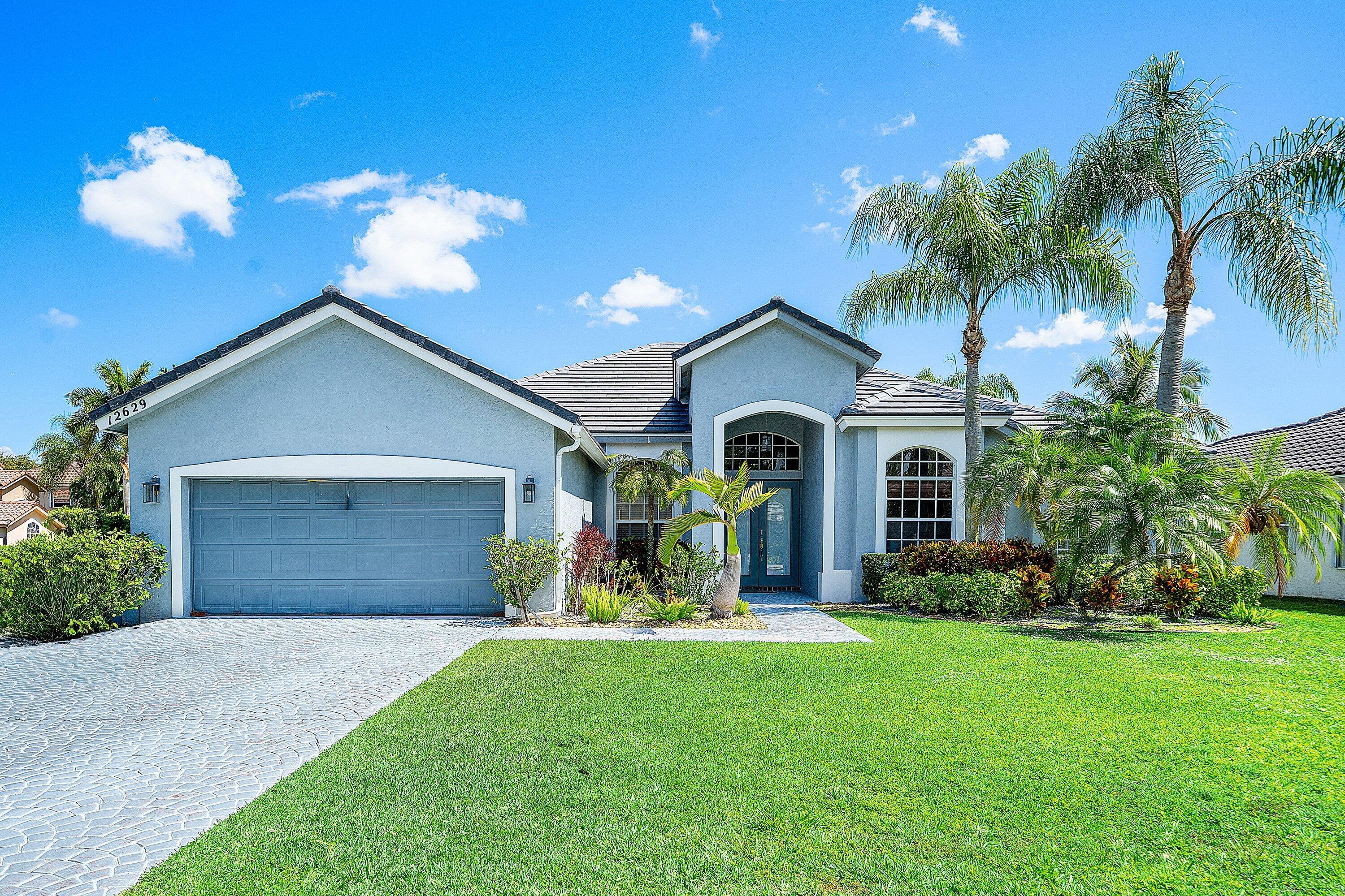 Beautiful 5 bedroom, 3 bath split floorplan in the desirable community of Boca Falls. New Roof (2025). Master bedroom boasts a large walk in closet, dual sinks in bathroom, wood floors and french doors that lead out to the beautiful screened in pool with a corner lake view. All the closets have been built out, newer AC, salt water pool with new heater, and much more. This home will not last and is a must see. Boca Falls has a newly renovated playground, clubhouse, extra large community pool, fully equipped gym, tennis and pickle ball courts. Walk to A-rated schools.