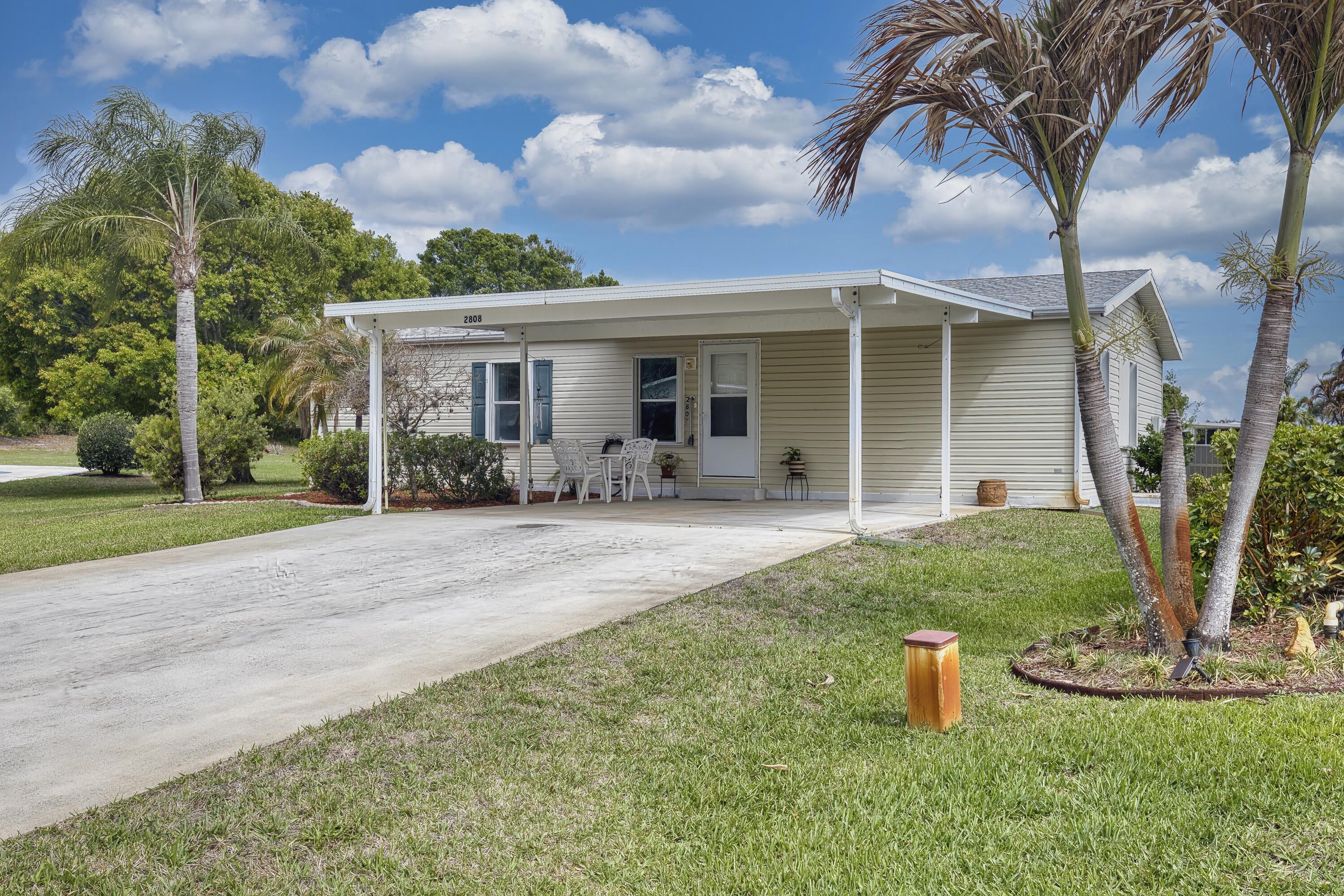 Move in ready, 2 bedroom, 2 bath home featuring a desirable split bedroom floor plan, ideally situated on a quiet cul-de-sac with beautiful lake views all on an oversized lot.  The spacious driveway accommodates up to 6 vehicles, offering plenty of parking for guests.  Inside, you will find durable and stylish LVP flooring throughout.  Newer roof 2021, accordion shutters for storm protection and includes a convenient attached storage shed.  Located in the desirable 55+ community of Savanna Club featuring 3 clubhouses, 3 pools, fitness centers, 18 hole golf course, on-site restaurant, and a 10,000 sq ft theater. Cable and internet included.  Priced to sell and offered as-is.  Don't miss this opportunity!! Schedule your showing today!!