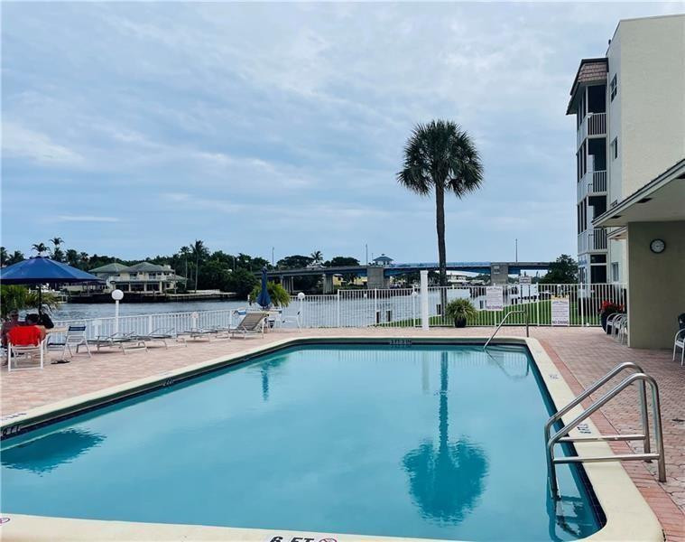 Welcome to this charming 2 bedroom, 2 bathroom first floor condo with beautiful garden view located in the heart of Boynton Beach, walking distance to the beach, shops, banks, restaurants & more . Amazing heated pool direct on the intercoastal, clubhouse, shuffleboard & exercise room. Newer seawall, pool deck and roof. Assigned parking ,Beautiful updated furniture, large suite with very spacious walking in closet. Water, Cable & Internet included in the condo fees! Unit can be rented after 1 year ! Furniture negotiable. Snug Harbor is an active 55+ community.  Foreigner Seller - FIRTPA addendum must be signed.