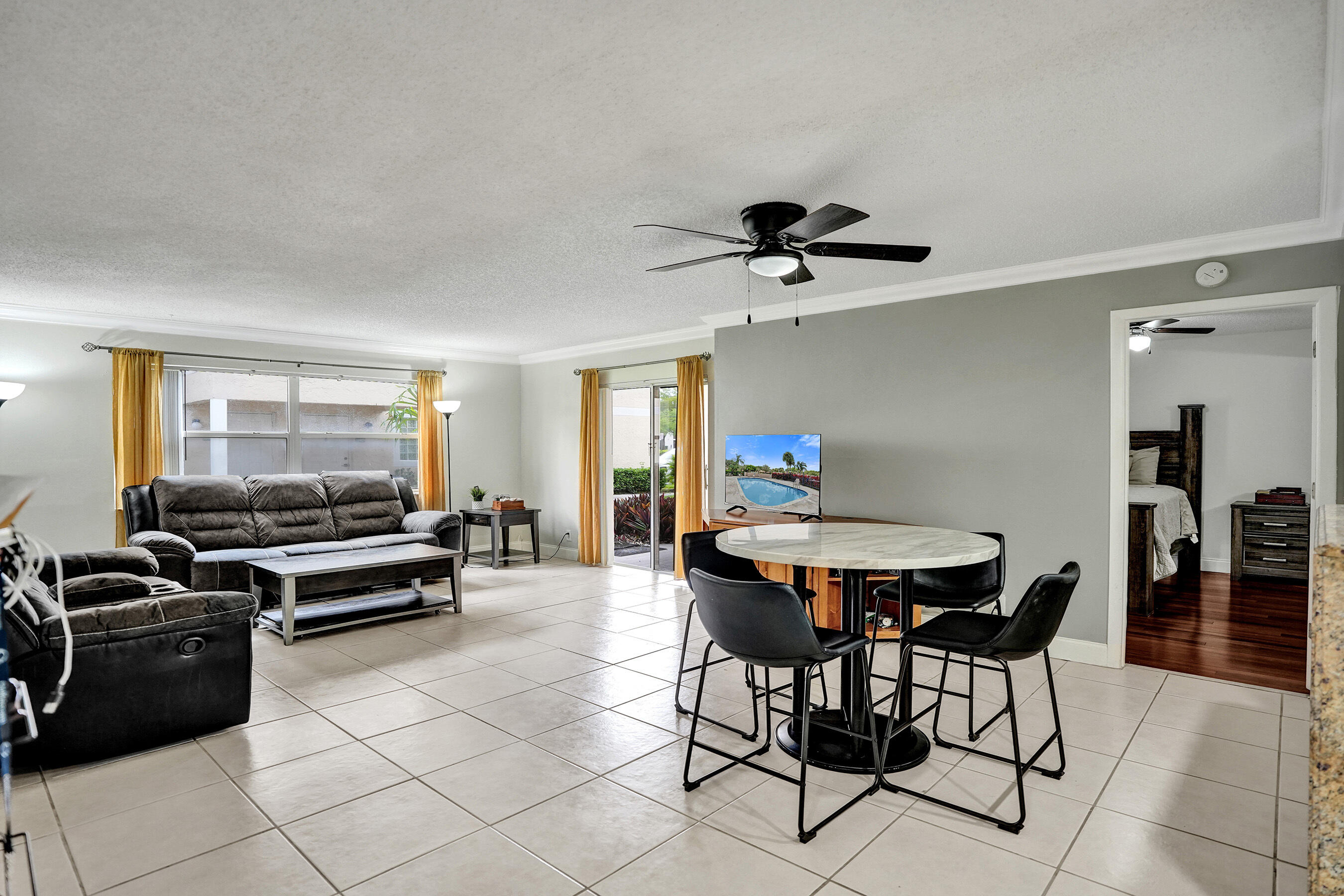 Beautifully Renovated First-Floor Condo in Prime Location!  Move right into this updated 3-bedroom, 2-bathroom first-floor unit featuring a modern kitchen with granite countertops, stainless steel appliances, and a smart, open layout. Enjoy wood flooring in the bedrooms and tile throughout the main living areas.  Located in a desirable community within a top-rated school district, just minutes from the Sawgrass Expressway, shopping, dining, and a world-class aquatic complex.  Well-maintained, move-in ready. No FHA.  Schedule your showing today—this one won't last!
