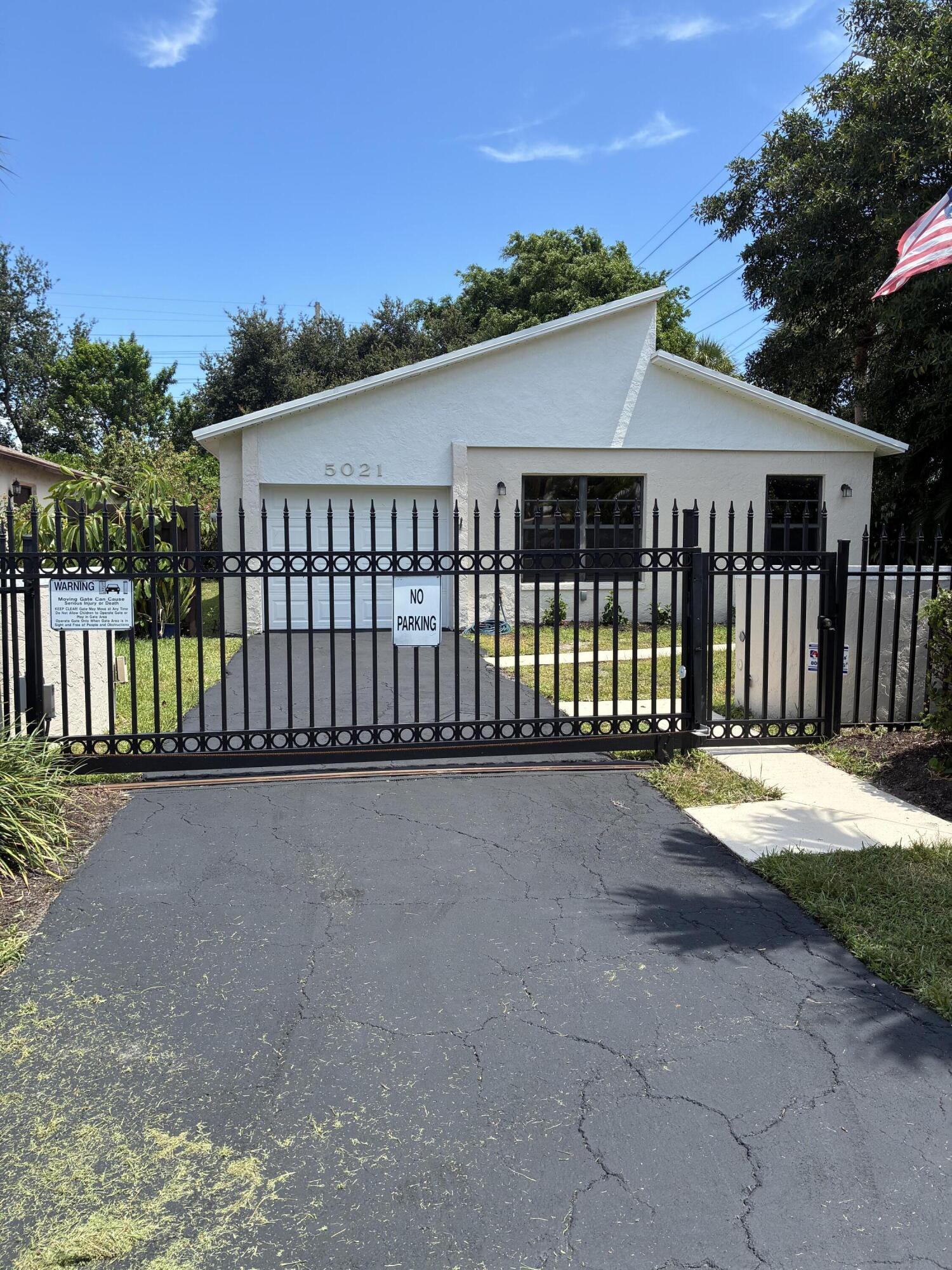 This beautiful home is a rare 3BR 2BA for Mirror Lakes.  New paint and landscape outside.  Newer A/C and Water heater and roof 2025. Wood window blinds in every room.  This very spacious unit with new bedroom flooring and tile throughout main area. Impact windows throughout home.  Ceilings fans and newly painted main area.  Beautiful large baseboards and crown molding. Pull down attic stair in garage.  This is a must see.