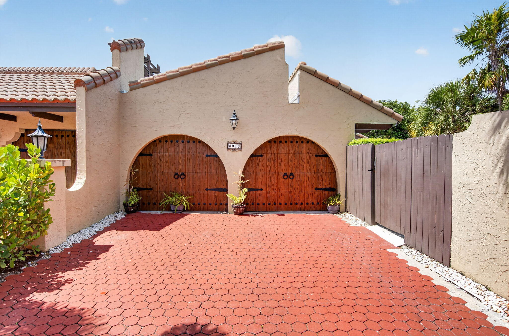 Discover One of Central Boca's Best Kept Secrets! Rarely available, this spacios home with open floor plan features 3 bedrooms plus a den, 2 updated baths, vaulted ceilings, spacious living areas, and beautiful lake views. The flexible floor plan is ideal for working from home or 4th bedroom. Enjoy indoor-outdoor Florida living from the screened patio and private outdoor spaces. Impact windows & doors. Newer Roof. Decorative wood burning fireplace. All porcelian floors. Minutes from shopping, dining, major highways. A rated Boca schools. A rare opportunity you won't want to miss!