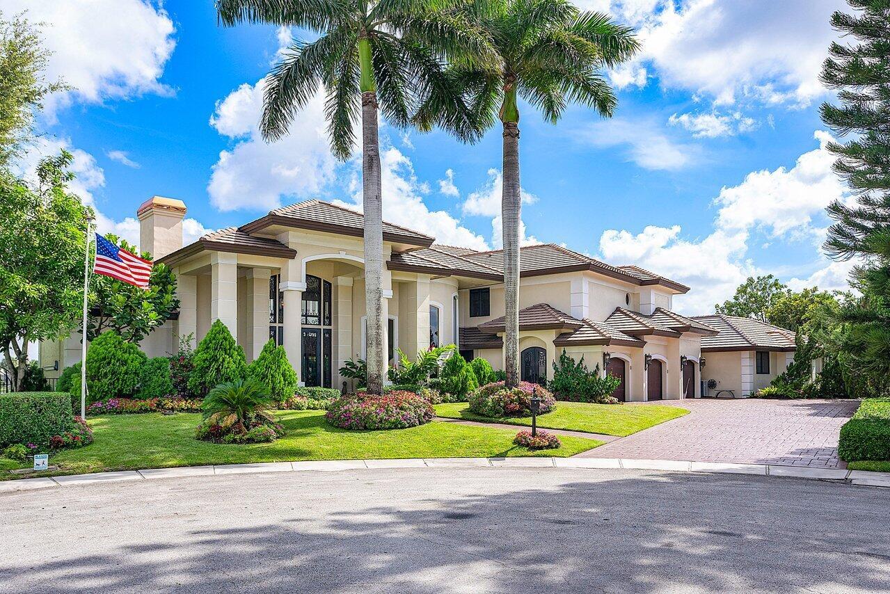 This spectacular,timeless,one of a kind 7,373 square ft. residence is situated on a superior .46-acre pie-shaped lakefront trophy lot with 235 ft of water frontage on a quiet cul-de-sac. Breath-taking long-lake views inside and out! All 5 spacious en-suite bedrooms and all the living areas have gorgeous views of the lake.  Features include a large heated saltwater pool and spa with a resort-style yard,with gas fire features (2 fire bowls and an outdoor fireplace). Large outdoor kitchen with built-in refrigeration,large grill with rotisserie,wok burner,sink,and built-in stainless drawers. The first floor offers an open floor plan with soaring ceilings in the foyer,living room,dining room,and family room. The temperature-controlled wine room features a custom iron door and wet bar. A gorgeous two-sided wood-burning fireplace is between the living room and formal office. 5-zone air-conditioning units installed in 2017 and 2022. Full LED lighting inside and out. The home has a magnificent chef's kitchen equipped with beautiful crystal light fixtures and a breakfast area with seating for 8. The kitchen is equipped with Wolf range with two ovens, a grill and griddle,custom 36" X 27" stainless steel chef sink,a large separate vegetable sink, two separate Miele dishwashers split into four drawers,Wolf steam/convection oven,Wolf microwave,Wolf warming drawer,Miele plumbed-in coffee system,Miele cup warmer,expansive Sub-Zero refrigeration,Sub-zero large freezer column,two separate built-in Sub-zero refrigeration drawers,Sub-Zero ice machine,all surrounded by top-of-line cabinetry with two large pull-out spice racks on each side of the range,and large quartz countertops. There are 3 cold water purifying systems with built-in dispensing faucets (2 in the kitchen and one system in the master suite). The large kitchen island has a custom built-in butcher block on wheels with a knife drawer. It rolls easily to the formal dining room for easy table-side carving (a brilliant feature for entertaining). There is a separate wet bar with a Sub-Zero refrigeration,a Sub-Zero ice machine,and a sink. This home is a state-of-the-art "Digital Smart Home" (custom security,surveillance,audio,video,lighting,shading,pool,spa,and sprinkler system - all controlled by a touch of a finger). The home features hurricane-impact glass windows and doors with 4-separate triple "stackable" hurricane-impact sliding glass doors. When arriving at this amazing home,you will be welcomed by a 20-foot-high custom iron-door entry with Miami-Dade hurricane glass. 24 x 24 light color Saturnia marble floors and Brazilian walnut high-gloss wood floors. Large custom mahogany office (bedroom) with fireplace and full bathroom. Spacious 1,000-square feet of covered patio space with 7 ceiling fans and outdoor television. High-end sound system with built-in speakers inside and outside. Cat 5 wiring throughout. Extremely large laundry room equipped with full-size Sub-Zero refrigerator-freezer, oversized washer and dryer, and large utility sink;laundry room also has extensive custom cabinetry with immense storage,a working desk area,and granite countertops. A full irrigation system is provided by lake or city water. An additional custom patio area (Herb Garden) with custom-colored LED lighting greets you out front. Spectacular landscaping with various fruit trees, a spacious private fenced yard with approximately 2,500 square feet of artificial turf, and custom arched iron gates. Large, finished, air-conditioned 3-car garage equipped with Tesla car charging system; expansive driveway capable of parking up to 8 + cars. The home is equipped with a stand-by Generac generator. Marble,granite, and quartz bathrooms throughout. The grand curved iron staircase leads to the second floor. The second floor is an oasis within itself as the entire second floor is a spectacular master bedroom suite with a completely private bathing sun deck. The master suite has expansive long-lake views and a huge open balcony of over 1,000 square feet with custom railings. This is a fantastic area for entertaining as there is a custom spiral iron staircase that takes you to the resort-style backyard. Enjoy kayaking, paddle-boarding, and bass fishing right from your backyard. This custom home sits on one of the most desirable waterfront point lots and is indeed one-of-a-kind! Homeowners in Woodfield Hunt Club may join Woodfield Country Club. Close to the Boca Raton Airport as well as Boca Raton's best public and private schools including Pine Crest and St Andrews. Woodfield Hunt Club, a prestigious gated community, boasts 328 luxurious single-family homes. Residents can indulge in a range of top-notch amenities, such as a Clubhouse, a state-of-the-art Fitness Center, Clay Tennis Courts with a Tennis Pro for private sessions, playgrounds, and basketball courts. Experience an exceptional lifestyle in this highly sought-after neighborhood!