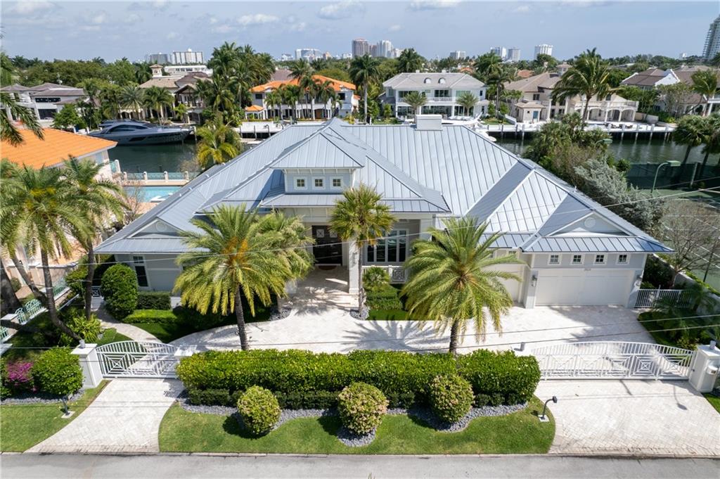 "PRISTINE"!!! This stunning gated coastal modern estate is unrivaled! Elegant and Beautiful...4 Bedrooms, 5 & Half Baths, Office/Library, 3 Car Garage. Boasting a 120 ft. concrete dock on a wide river with No Fixed Bridges and minutes to the Atlantic Ocean. Private Beach Membership Offered with changing rooms and barbecue grills.