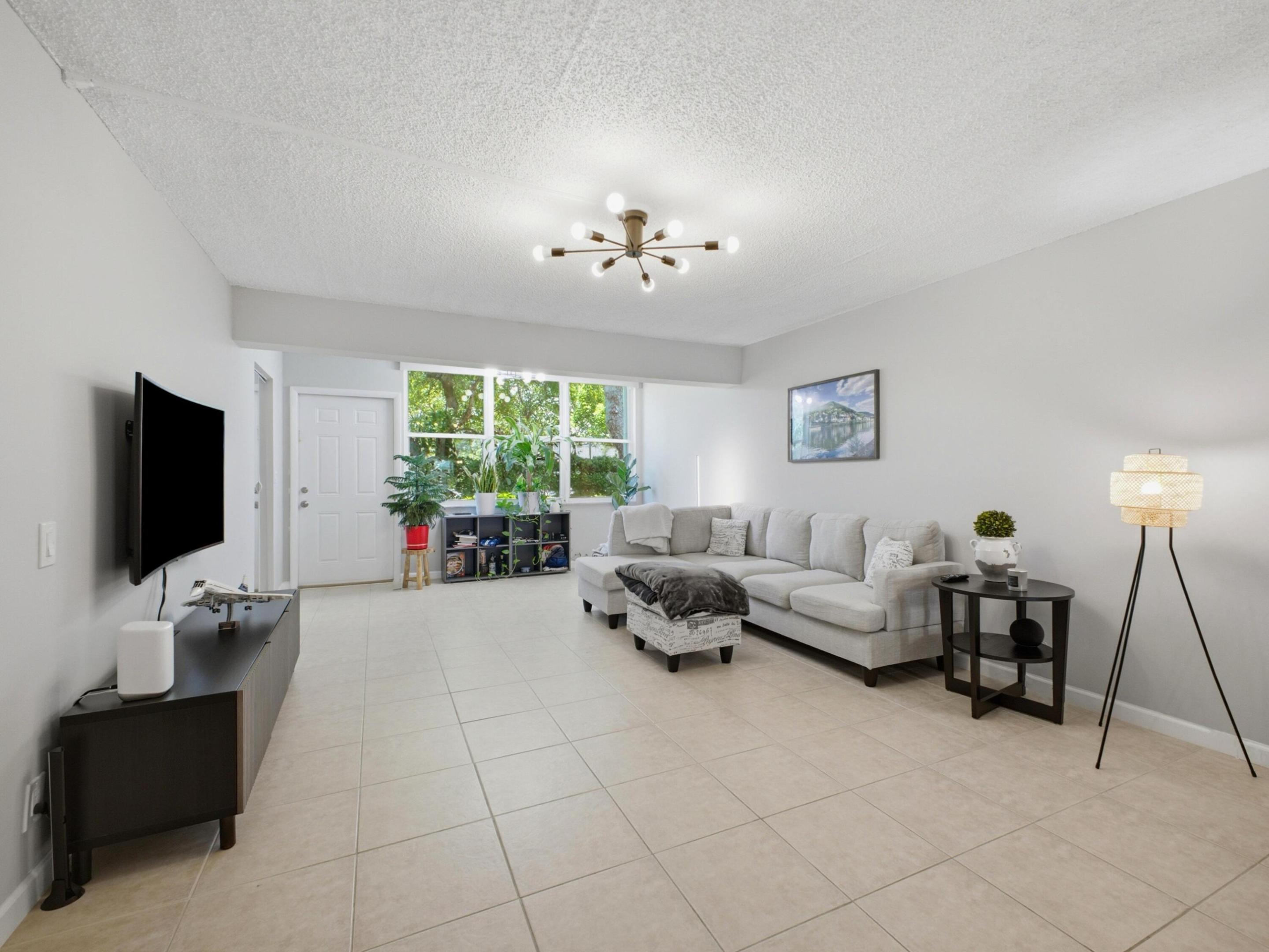 Wonderful opportunity to own or invest in this beautifully maintained 2-bedroom, 2-bath first-floor condo in the all-ages section of Sabal Pine South in desirable Delray Beach. Tucked away in a quiet setting with a private backyard feel and tranquil views, this bright and inviting residence offers abundant natural light, luxury vinyl plank flooring in the bedrooms, tile flooring throughout the main living areas, and an in-unit washer and dryer. The spacious primary suite is large enough to accommodate a king-size bed with furniture and features a walk-in closet. The kitchen offers ample space for cooking and everyday living, while thoughtful updates include a 2019 electrical panel, 2015 water heater, 2025 washer, 2019 dryer, and a 2024 dishwasher.  The home also features hurricane panels on the front two windows and impact protection on the remaining windows. Residents enjoy a pet-friendly, well-maintained community with a pool, one assigned parking spot, and ample guest parking. With a new roof in 2018, recently painted buildings, a low monthly HOA of $491, strong reserves, and no upcoming assessments, this move-in-ready condo offers exceptional value. Conveniently located just minutes from Atlantic Avenue, I-95, Whole Foods, Trader Joe's, shopping, dining, downtown Delray, and the beach, this is a rare opportunity to enjoy quiet community living close to it all.