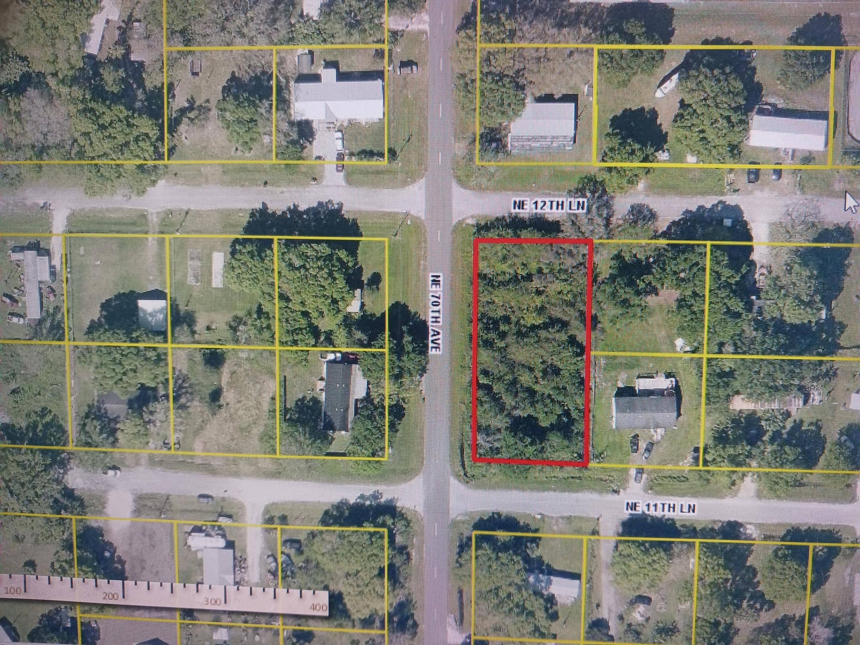 FOUR SEASONS:  Corner lot that extends thru to 12th lane.  Great to build home for commuters to coast as close to Highway 70 East.  Plenty of room for home and extra building or workshop.  Lots of shade trees, but has not been cleared.  Utilities are available.  There are other houses in the area