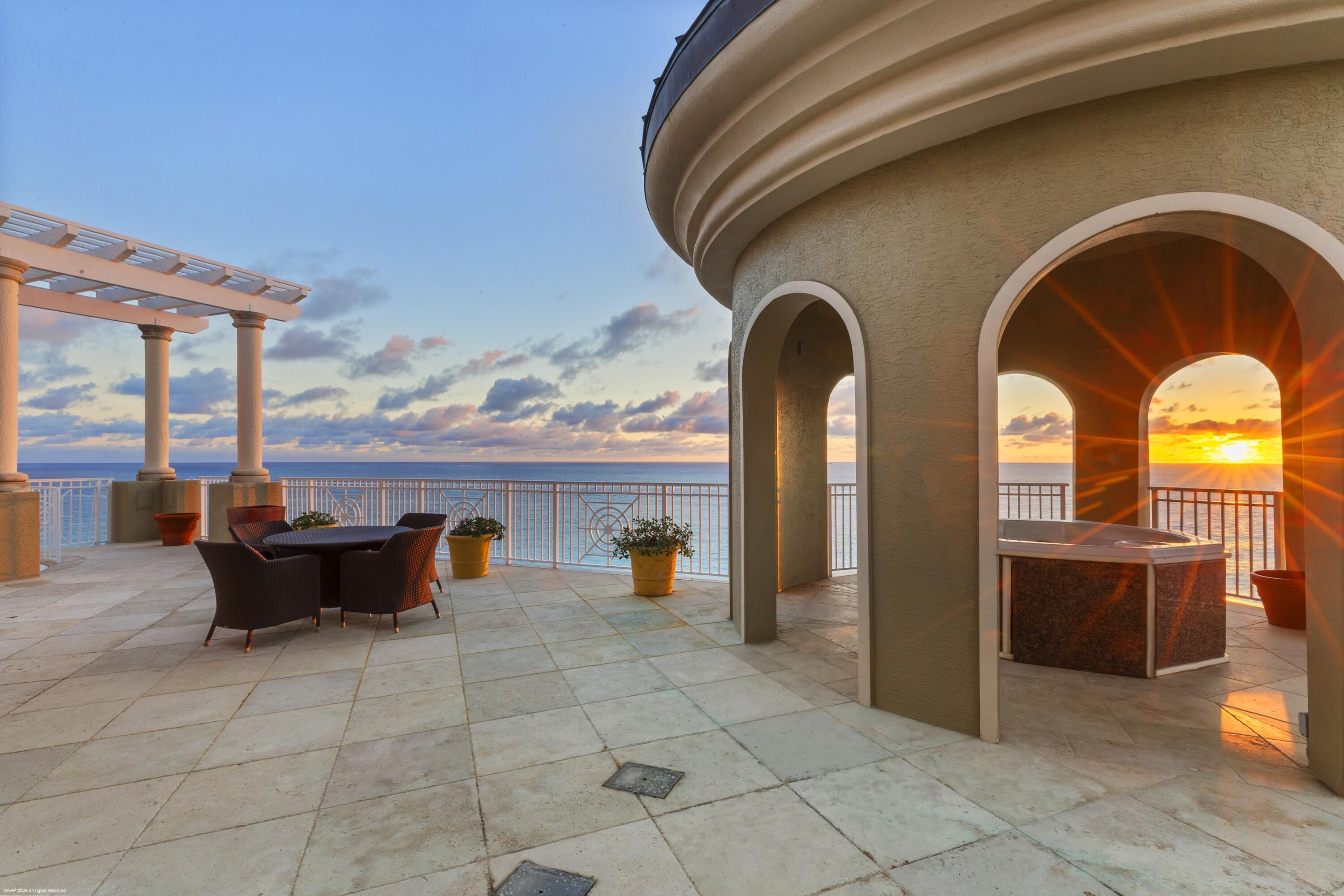 Perched atop ultra-exclusive One Singer Island (15 residences), this commanding two-story sky home delivers sweeping Atlantic-to-Intracoastal panoramas. 6,000 SF under air plus ~3,500 SF of terraces offers 3 bedrooms, 6 baths, a private office/Florida room, a majestic great room, & an ~800 SF upper-level sky lounge with fireplace, kitchenette, & half bath. The great room stuns with an 11' hand-painted ceiling & gas fireplace with illuminated onyx base. Formal dining & TV den/breakfast room. Seven terraces + Juliet balcony capture sunrise oceanfront & sunset Intracoastal—plus 2 Jacuzzis. Spiral stair to a breathtaking huge upper oceanfront terrace. Intra-coastal waterway terrace is equally stunning for sunsets.  The pinnacle of boutique penthouse living on Singer Island—don't miss this gem Welcome to a true sky-estate: a direct oceanfront penthouse with sweeping, cinematic views of both the Atlantic Ocean and the Intracoastal Waterway, offered within the rare privacy of One Singer Island. WCI's ultra-luxury "One" designation (only three buildings statewide share this distinction).

Spanning 6,000 square feet under air and complemented by 3,500 square feet of terraces, this residence is built for the buyer who wants scale, presence, and effortless indoor-outdoor living a one-of-a-kind penthouse in a one-of-a-kind boutique building.
Designed for impact and for living, the floor plan includes 3 bedrooms, 3 full bathrooms, 2 half bathrooms, plus a private office/Florida room adjacent to the primary suite. The grand great room is visually unforgettable, featuring a hand-painted 11-foot ceiling and a gas fireplace with a backlit onyx lower panel, along with a formal dining area and TV den/breakfast area all framed by the endless ocean-and-beach backdrop that makes Singer Island so coveted. Completing the experience is a breathtaking ~800 sq. ft. private sky lounge on the second level with an additional huge oceanfront terrace.

Seven terraces. Endless perspectives.
Outdoor living is elevated to an art form with seven terraces (plus a Juliet balcony) each capturing a different angle of coastline, skyline, and waterway. The expansive oceanfront balcony is the signature setting for sunrise coffee, ocean breezes, and panoramic Atlantic views. The Intracoastal terrace delivers a different mood entirely glowing evening vistas and a Jacuzzi for relaxing or entertaining under the shoreline lights. A spiral staircase rises from the lower oceanfront terrace to an extraordinary upper-level oceanfront patio with its own jacuzzi, creating a private outdoor retreat that feels worlds above everything else.
The ultimate second-level bonus: your private sky lounge
The second level features an incredible bonus room of approximately 800 square feet under air, with another fireplace, a half bath, and a kitchenette ideal as a game-day lounge, cocktail salon, media retreat, or elevated hosting space that separates beautifully from the main living level. It is clad in truly stunning pecky cypress wood.

Luxury finishes and a serious chef's kitchen
The gourmet kitchen is equipped for true cooking and entertaining with a 48" Sub-Zero refrigerator, Wolf appliance package, double ovens, warming drawer, microwave, gas cooktop, wine cooler, Miele built-in coffee system, and granite countertops. Additional highlights include marble and wood floors, custom inlays, custom built-ins, custom window treatments & plantation shutters, and two premium parking spaces. Many fine upgrades and top-shelf finish run throughout, including a large, air-conditioned storage room off the laundry and a huge storage cage in the ground-floor air-conditioned storage room.

Boutique building. Full-service lifestyle.

Custom Interior Features
Wet bar in the den/TV room
Mirrored accent wall in the den/TV room
Onyx flooring in the entry foyer
Two custom floor inlays
Decorative wall paneling in great room
Custom built-in bookcase in the great room
Custom tile fireplace surrounds with illuminated onyx base
Custom built-in desk, cabinetry, and shelving in the office
Custom wainscoting in the office
2 gas fireplaces (in great room and upstairs sky lounge)
Custom stone fireplace surrounds in sky lounge
Pecky Cypress clad wet bar, built-ins & wainscoting in sky lounge

One Singer Island is one of only three towers in Florida to earn WCI's coveted "One" ultra-luxury designation reserved for properties that set the standard for architectural distinction, exclusivity, and residential design. With just 15 private homes, the experience is intentionally intimate: discreet service, quiet hallways, and a true sense of arrival. An entire amenity level is curated as a private club for residents designed for entertaining, wellness, and relaxed oceanfront living while outdoors, the setting is equally rare, with direct beach access and miles of protected shoreline stretching toward John D. MacArthur Beach State Park.

Amenities & Services
Oceanfront heated pool and spa
Direct beach access via wood boardwalk
Oceanfront dog park plus additional dog area
Bicycle storage
State-of-the-art fitness center (rarely crowded)
Private theater with stadium seating and advanced A/V
Elegant club room with bar and seating
Versace-inspired outdoor patio with fireplace
Catering kitchen for parties and events
Temperature-controlled wine room/private lockers & tasting tables
Concierge service (daily coverage 7:00am-11:00pm)
On site maintenance staff

About Singer Island
Situated on the quieter end of Singer Island, this gated beachfront enclave offers a level of tranquility buyers rarely find such as a quiet beach, miles of walkability, and frequent wildlife sightings (manatees, rays, and more). This isn't just penthouse living it's a Florida oceanfront experience.

Nestled along Florida's Atlantic coastline, Singer Island is a tropical paradise renowned for its pristine white sandy beaches, exquisite waterfront homes, and charming resort lifestyle. This exclusive community, located in Palm Beach County, offers breathtaking ocean views and a vibrant marine and wildlife environment. Spanning 1,500 acres, Singer Island is home to three distinct communities, a stunning state park, and an array of upscale hotels. Founded by Paris Singer, the son of sewing machine magnate Isaac Singer, this idyllic island is steeped in history and elegance. Just 15 minutes from Palm Beach International Airport and a short drive from Miami, Singer Island seamlessly combines natural beauty with convenient access to world-class shopping, dining, and recreational opportunities.

A haven for outdoor enthusiasts, Singer Island is celebrated for its crystal-clear waters, blue water sport fishing, and thrilling activities such as sailing, windsurfing, jet skiing, and boating. Its location offers proximity to renowned golf courses, luxury shopping destinations like Worth Avenue, and the upscale amenities of nearby Palm Beach Gardens and Jupiter. Whether enjoying the island's vibrant lifestyle or retreating to a serene, luxurious residence, Singer Island offers the ultimate in sophisticated, coastal living.