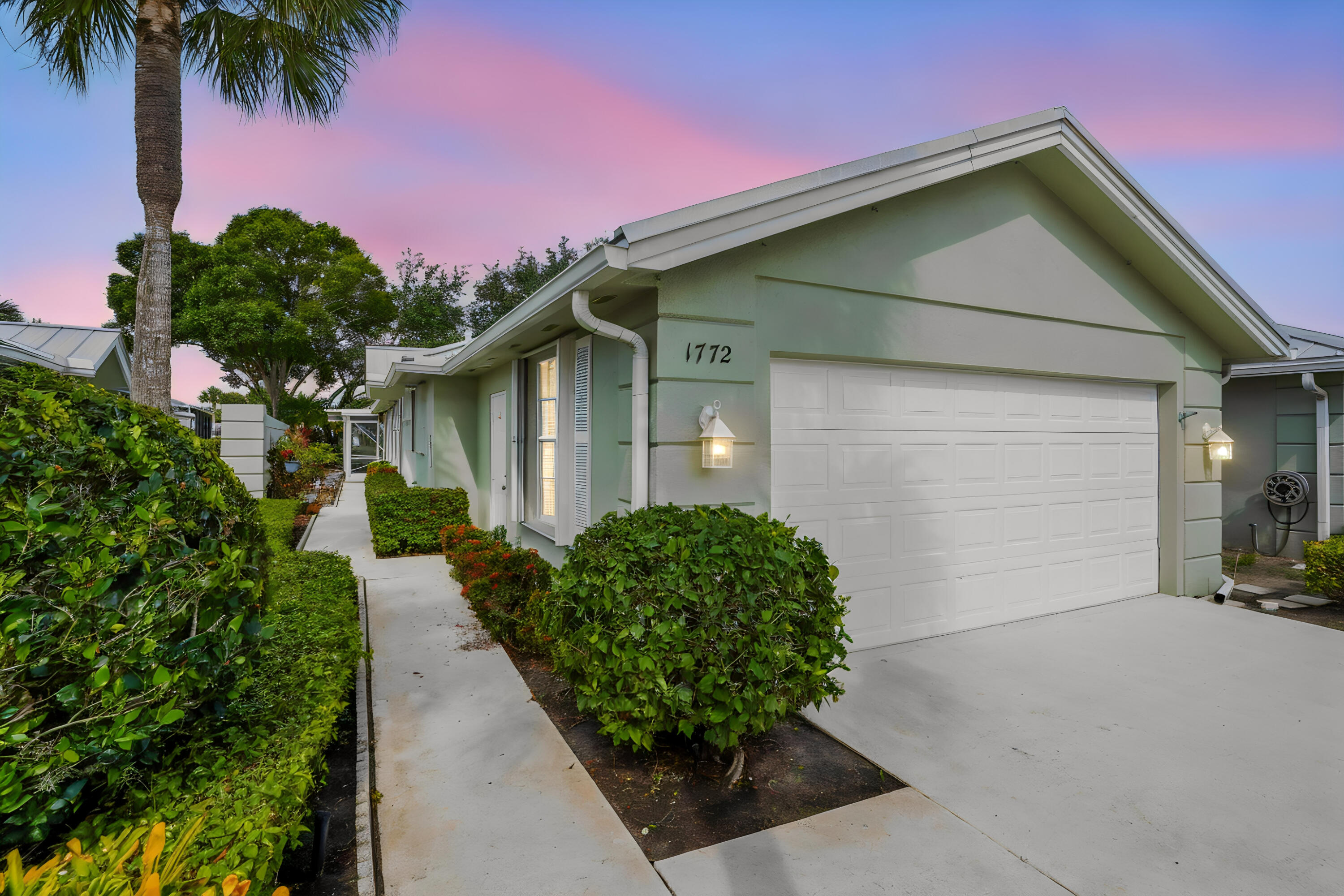 Welcome to 1772 SW Waterfall Blvd in the heart of Palm City, where comfort, style, and relaxed Florida living come together beautifully. This inviting home features a bright and airy layout with spacious living areas, soaring ceilings, and an abundance of natural light that creates a warm and welcoming atmosphere throughout. Thoughtfully designed for both everyday living and entertaining, the open flow between the main living spaces and outdoor areas makes the home feel effortlessly connected and serene. Generously sized bedrooms provide peaceful retreats, while the primary suite offers a private escape with tranquil views and plenty of space to unwind. Outside, enjoy an extended covered patio and large screened enclosure over looking the beautiful lake.  Surrounded by lush landscaping and located in one of Palm City's most desirable communities, this property offers the perfect balance of privacy and convenience. Enjoy easy access to top-rated schools, golf courses, marinas, shopping, dining, and the beautiful Treasure Coast beaches, all just minutes away. Whether you're looking for a full-time residence or a seasonal retreat, 1772 SW Waterfall Blvd delivers the ideal Florida lifestyle with timeless charm and exceptional comfort.