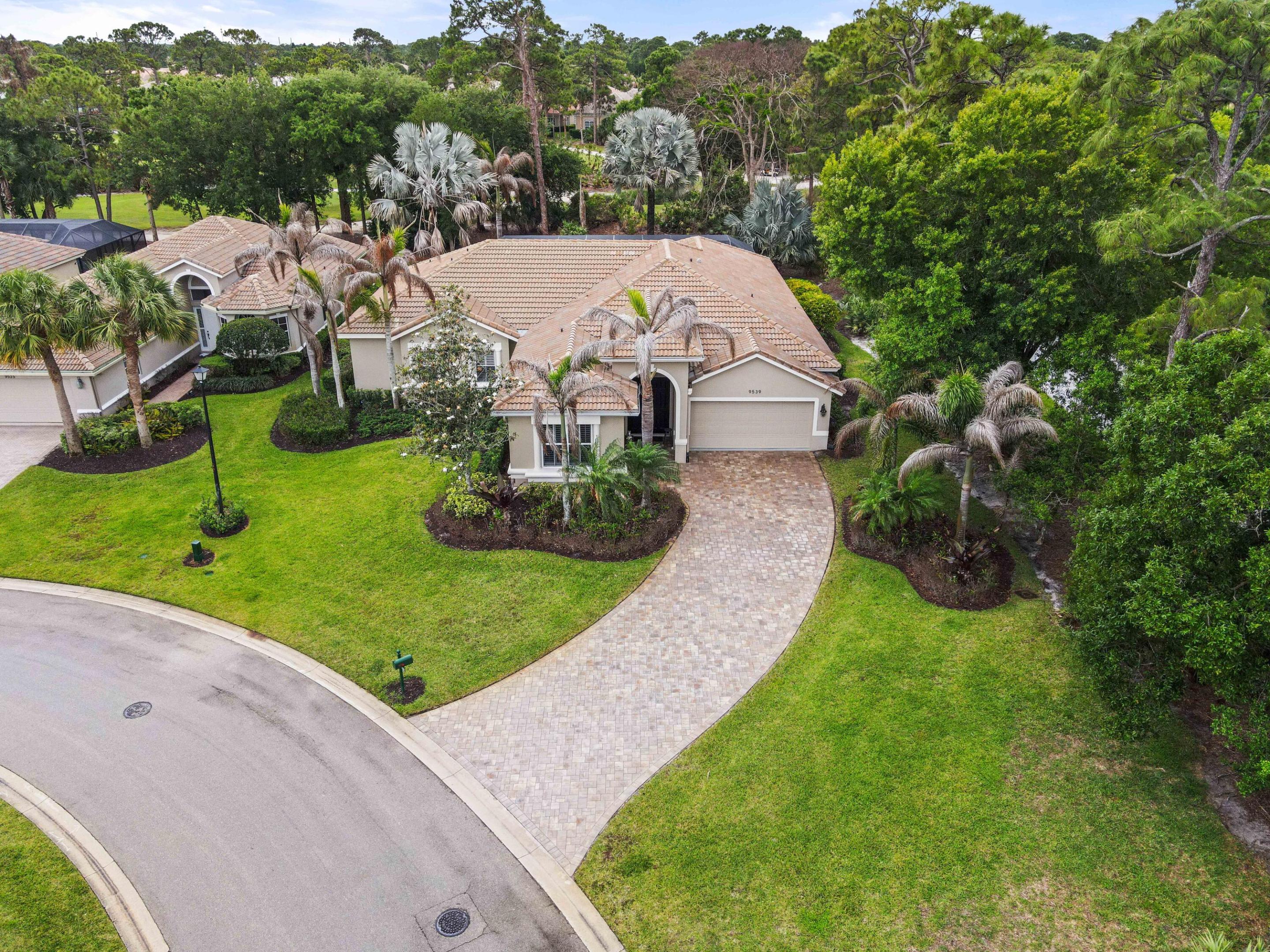 Motivated Seller! *Will consider all offers* Welcome to The Pines at the Reserve, where space, comfort, and scenic golf course views come together in this beautifully maintained single-story home. Situated on a desirable corner lot spanning 0.33 acres, this property offers 3,115 sq ft of living space designed for both everyday living and entertaining.  Step inside to find porcelain tile flooring throughout and high vaulted ceilings that create an open, airy feel. The home features 3 bedrooms and 3.5 bathrooms, plus a versatile office/den that can easily be converted into a 4th bedroom. Two spacious master suites, each with walk-in closets, provide flexibility and privacy.  A hallway laundry room includes a washer, dryer, and utility sink for added convenience. Additionally, the home includes an air-conditioned 8' x 10' attached storage room located at the rear of the home, just outside the pool enclosure, providing ample space for storing storm shutters and additional belongings. Enjoy outdoor living at its finest with an oversized screened patio and private pool, complete with a brand-new screen enclosure (2026), all overlooking serene golf course views. Additional highlights include a 2-car attached garage, extended driveway for extra parking, and major updates such as dual AC units installed in 2022 and a 2001 build with a 2014 addition. This property offers a rare combination of size, layout, and location ideal for those seeking both comfort and lifestyle.