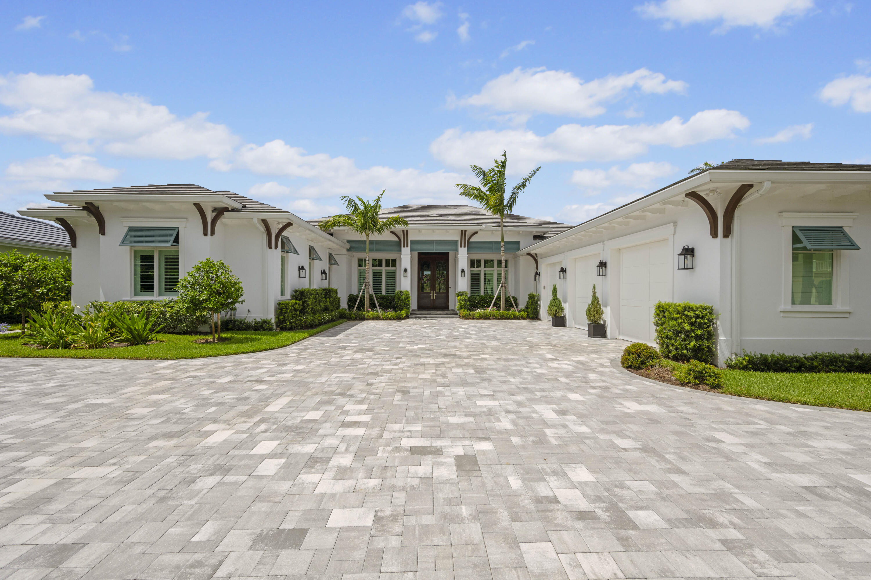 Welcome to 206 Locha Drive, an unrivaled, newly constructed masterpiece in the exclusive Loxahatchee Club, located in the luxury golf capital of the world. This state-of-the-art lakefront estate is a newly delivered statement of excellence, constructed on a rare, premium lot with unobstructed lake views. The residence offers a blend of sophisticated design and modern functionality. With no available lots or comparable opportunities in The Loxahatchee Club, this new construction home is truly one of a kind. This five-bedroom, six-bathroom estate includes a private office, four full baths, a powder room, and a cabana bath complete with a built-in dog wash station. Professionally curated and extensively upgraded, every detail has been thoughtfully considered. From the moment you enter the home, you're drawn to the grand impact sliders, framing stunning panoramic lake views. The gourmet kitchen is an entertainer's dream, featuring dual islands, natural gas cooking, a built-in Miele coffee system, an expansive butler's pantry, and exquisite designer finishes. The open-concept living and dining areas are highlighted by coffered ceilings, custom trim work, and a built-in entertainment wall, creating the perfect backdrop for luxurious gatherings and everyday living. The primary suite offers peaceful lake views, a spa-like bathroom with dual vanities, and a large walk-in closet. Designed for effortless outdoor living, the backyard features an infinity-edge pool with a sun shelf, a fully equipped outdoor kitchen, a gas fireplace, and hurricane-rated retractable screens, allowing you to enjoy the space year-round.  Beyond aesthetics, this home has been upgraded for maximum performance and efficiency, including foam insulation, a high-efficiency HVAC system, a whole-house water softener, whole-house generator, hurricane-rated windows and shutters, smart thermostats, and a full security system. Additional features include engineered hardwood flooring throughout, a central vacuum system, indoor and outdoor fireplaces, and beautifully landscaped grounds with a well-fed irrigation system.  Perfectly positioned within a prestigious community, 206 Locha Drive offers a rare opportunity to experience bespoke luxury in a home that effortlessly blends style, performance, and sophistication.  Each day offers a variety of activities and world-class amenities. Whether you're headed to the state-of-the-art fitness center, enjoying a spa treatment, or a refreshing swim, the Loxahatchee Club caters to your every need. The Signature Jack Nicklaus design offers a challenging and playable experience. After a day on the greens or the courts, explore the diverse dining options available within the community, from casual bites to gourmet culinary experiences, all just a short golf cart ride away. At the Loxahatchee Club, you're not just buying a home; you're embracing a lifestyle of unparalleled luxury and community. Explore the possibilities and envision making this your sanctuary, where every day feels like a vacation.