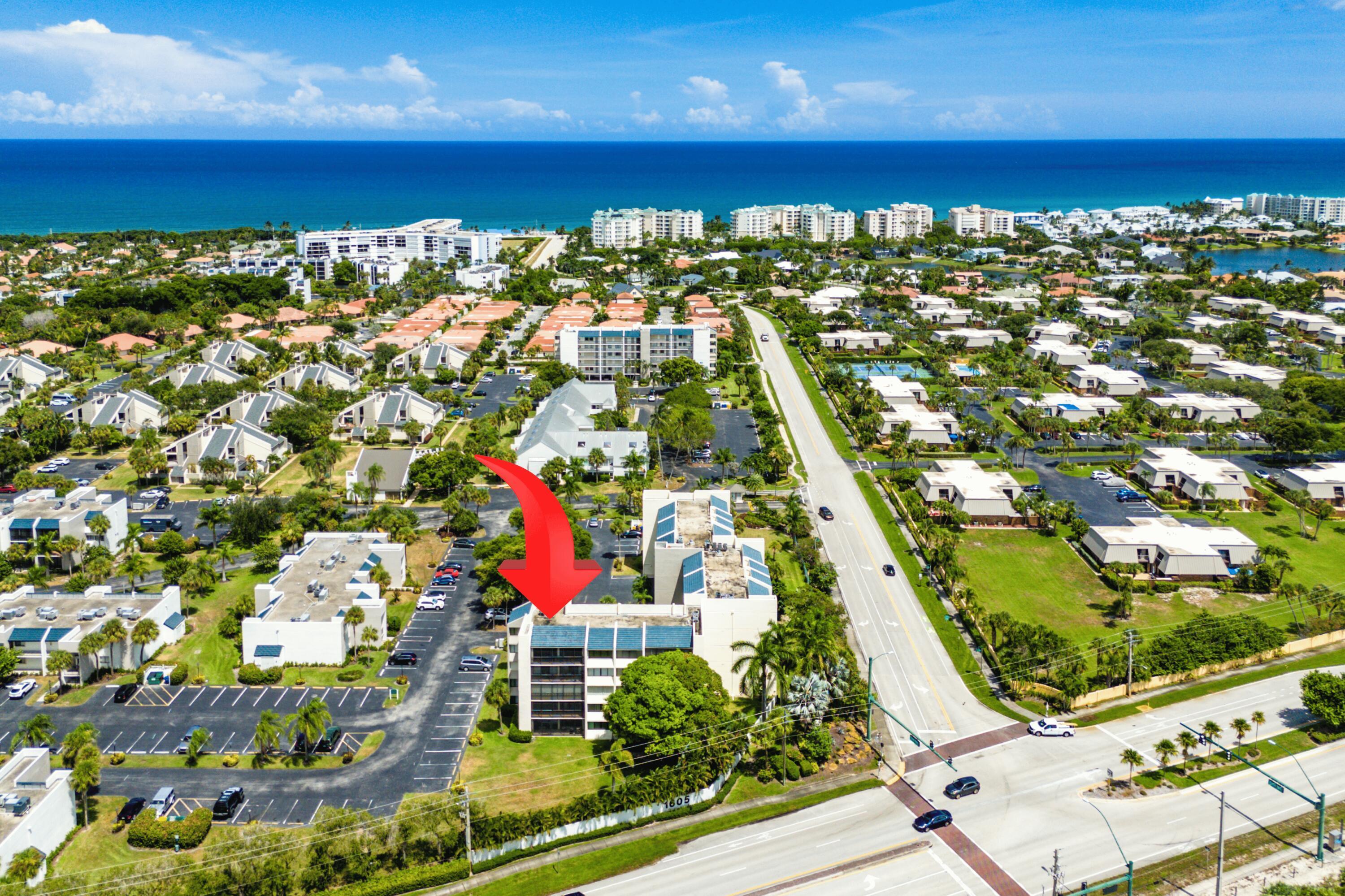 This turn key spacious 3 bedroom 3 bath top floor end unit is located very close to the beach as well as the Jupiter Reef Club. Complete Impact Windows & Sliders plus Accordion shutters, SS appliances & Granite in the kitchen, Custom lighting throughout, A/C 2015, Water heater 2020, East/West exposure. Enjoy slight peeks of the ocean from inside the unit. Building has strong reserves and all recent inspections/work are complete. Optional Jupiter Racquet Club membership available for tennis & pickleball lovers. Currently leased September 2026 through June of 2027 which provides immediate income. Highly rated schools and all ages welcome. 3rd bedroom configured as a den. Bring your bathing suit and enjoy South Florida at it's finest.  Seller financing with rate BELOW market considered.