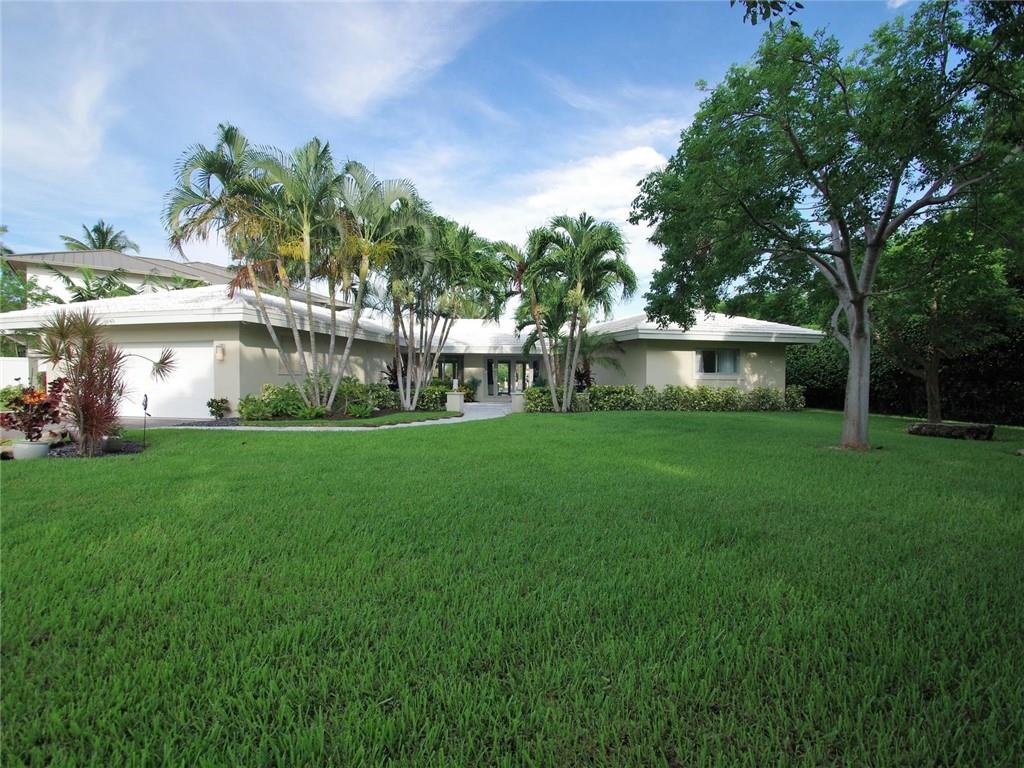 COMPLETE REMODEL AGAIN.  SUPERIOR MID-CENTURY WATERFRONT. NO EXPENSE SPARED. BRIGHT, OPEN, PRIVATE. PROPERTY IS LOCATED ON A 15,581 SQ FT LOT. READ THAT AGAIN - 15,531 SQ FT. MOST LOTS IN THIS NEIGHBORHOOD 10,OOO SQ FT OR LESS. RESORT STYLE DECKING AROUND MAGNIFICENT POOL AREA LEADING TO NEW DOCK IN DECEMBER 2019. CUSTOM DESIGNED DRAPES/BLACK OUT BLINDS IN EVERY ROOM. NEW A/C 2018. SPLIT UNIT A/C 2017. HOT WATER HEATER 2020.  ELECTRIC DRIVEWAY GATE 2018. CUSTOM CLOSET MASTER BEDROOM.RESORT STYLE LANDSCAPING. 2 WASHERS/2 DRYERS. WATER/POOL VIEWS FROM MASTER AND GUEST SUITE. ALL WINDOWS/DOORS IMPACT. SOUND SYSTEM THRU OUT AND POOL AREA ALONG WITH TV. DOCK WITH FULL UTILITIES. PERFECT HOME FOR ENTERTAINING AND LIVING THE BEST OF FLORIDA LUXURY LIFESTYLES. MINUTES TO BEACH/GALLERIA MALL. KITCHEN NORMALLY ONLY FOUND IN MULTI-MILLION DOLLAR HOMES. HIGH END STAINLESS STEEL APPLIANCES, WINE COOLER, NEWER ELECTRIC, NEWER SEAWALL/NEW DOCK. NEWER LANDSCAPING AND OUTDOOR LANDSCAPING.FINISHED GARAGE FLOOR. HUGE SAFE IN GARAGE. NEWER GRANITE IN KITCHEN. NEWER INSULATION AND NEWER VENTS THRU OUT. CUSTOM WINDOW TREATMENT IN EVERY ROOM. WHITE MARBLE FLOORING THRU OUT.