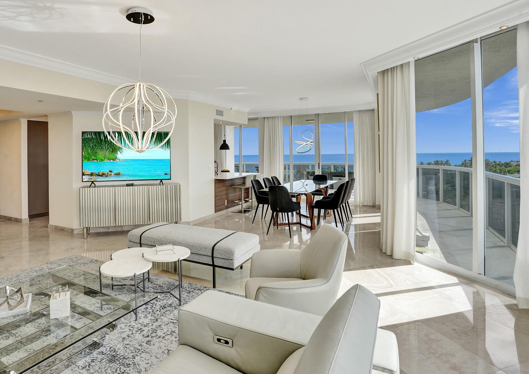 Beautifully Renovated wrap-around condo features 3BR, 2.5BA with Panoramic Ocean, City & Intracoastal views. High end features include modern kitchen and primary bath. Endless SE ocean views, 9' floor-to-ceiling windows, direct elevator entry into the unit, and 732 sf of expansive balconies. 2 parking spaces & storage unit. Guard gated complex with 24/7 security, front desk and valet. Amenities include 2 pools, 2 clay tennis courts, fitness center, poolside cafe (maintenance fees include a monthly cafe credit). Strong Financials w/recent improvements: facial recognition system. Pet-friendly!