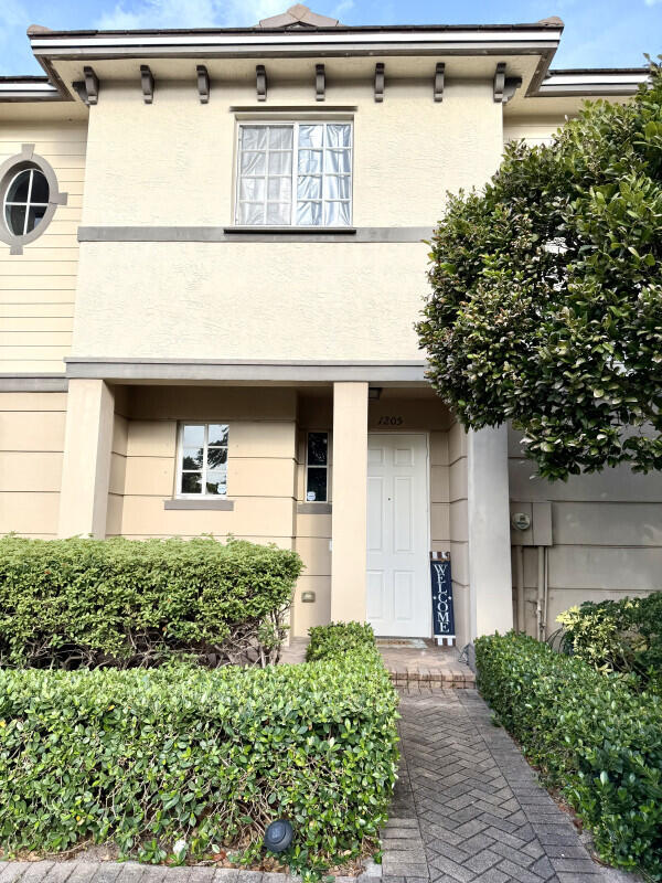 Well-maintained 2-bedroom, 2.5-bath townhome located in the gated Marsh Harbour community in Riviera Beach. Built in 2006, this two-story residence offers 1,222 square feet of comfortable living space with an open-concept layout designed for both everyday living and entertaining. The first floor features a spacious living and dining area, tile flooring, an open kitchen with pantry and snack bar seating, plus a convenient half bath for guests. Upstairs, both bedrooms offer private en-suite bathrooms, creating an ideal setup for families, roommates, or guests. The primary suite includes generous space and a functional layout with plenty of natural light.  Additional highlights include in-unit laundry, central air conditioning, and low-maintenance living within a gated community offering amenities such as a pool, clubhouse, fitness center, and tennis courts. Conveniently located just minutes from I-95, shopping, dining, Palm Beach International Airport, and some of South Florida's best beaches. Whether you're a first-time homebuyer, seasonal resident, or investor, 1205 Abaco Lane offers exceptional value and convenience in a rapidly growing Palm Beach County location.