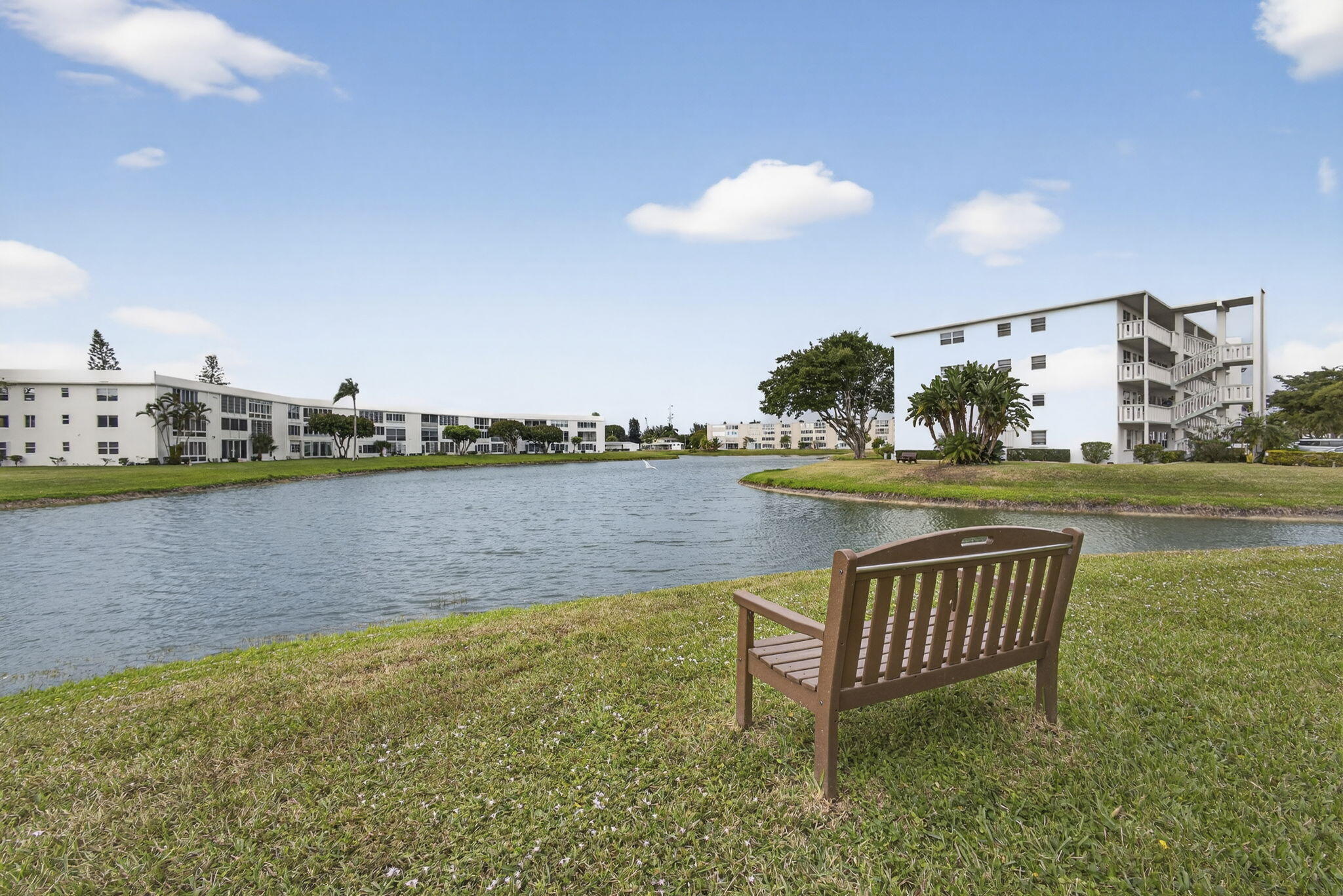 MOVE RIGHT INTO THIS SPACIOUS AND BEAUTIFULLY MAINTAINED FURNISHED 2 BEDROOM 2 BATH CONDO LOCATED IN SOUGHT-AFTER WELLINGTON G SECTION OF CENTURY VILLAGE, A GATED COMMUNITY FOR ACTIVE ADULTS 55+. THIS LIGHT , BRIGHT AND VERY CLEAN UNIT OFFERS STUNNING WATER VIEWS FROM MULTIPLE VANTAGE POINTS AND A SPACIOUS LAYOUT.IDEAL FOR COMFORTABLE LIVING. THIS TASTEFULLY FURNISHED HOME FEATURES CERAMIC TILING THROUGHOUT, CENTRAL AIR CONDITIONING AND NEUTRAL DECOR. THE OVERSIZED MASTER BEDROOM FEATURES AN ENSUIT BATH, LARGE WALK IN CLOSET AND DIRECT ACCESS TO THE OVERSIZED LANAI. ENJOY THE WATER VIEW FROM YOUR BED OR THE LANAI.  WELLINGTON RESIDENCE ENJOY TWO PRIVATE SWIMMING POOLS, OPEN PATIO, TWO LAUNDRY ROOMS AND TWO TRASH CHUTES ON EVERY FLOOR.  VERY WELL RUNNED ASSOCIATION, BUILDING HAS A NEW ROOF. COME & ENJOY RESORT STYLE LIVING IN THIS GATED COMMUNITY FOR ADULTS 55 +. LUBHOUSE features a theater, indoor pool, card room, community/party room, billiard room ,shuffle board ,tennis , pickqleball ,bocce and two outdoor pools. Numerous heated outdoor pools throughout the community. Separate fitness center with gym , outdoor heated pool and a resistance pool. Two guarded gates and 24 hour roving security patrol. GREAT LOCATION: close to shops, restaurants, PBI airport and beaches.