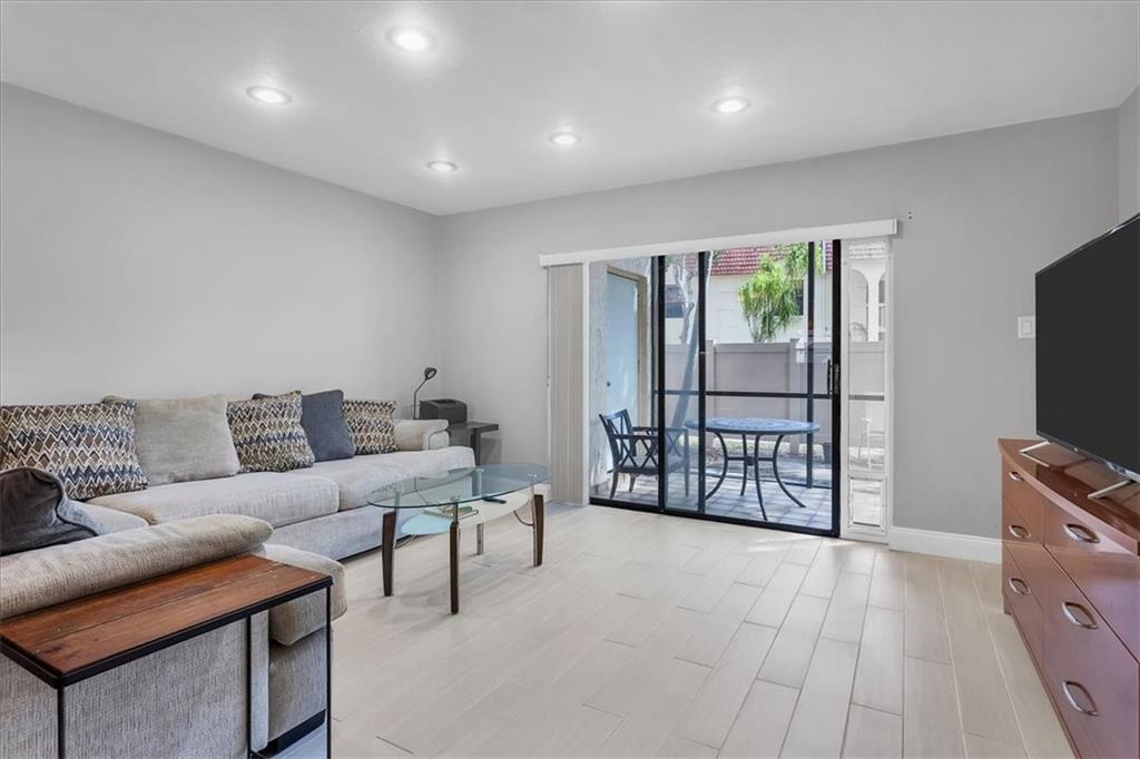 Welcome to a two-bedroom, two-bathroom condo located on the first floor with parking space directly in front of the entrance. Featuring an open kitchen, space for a small wine refrigerator, and split bedrooms. The screened-in patio with a private fence ensures the enjoyment of your outdoor space. Some windows have roll-down shutters. The water heater and air conditioner are older models. The pool area, clubhouse, and tennis courts are currently undergoing upgrades, assessment has been paid. Cypress Park is located approximately one-and-a-half miles from the beach and within close proximity to great restaurants, Publix, I-95, and only one-half block to the new cultural center. No leasing for the first two years.