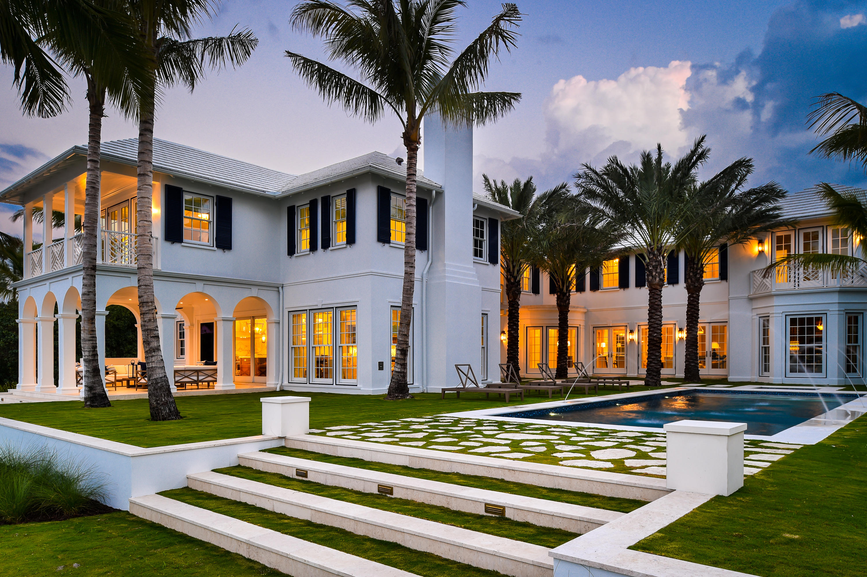 Brand new, furnished Everglades Island point estate. Gorgeous British Colonial with commanding lake views from three sides. Built by Malasky Homes, this estate features 5BR/6.1BA plus library, 1BR/1BA guest apartment, fireplaces, wine cellar, and elevator. Master wing features sitting room, dual baths and closets, and three balconies. Beautiful backyard with pool, spa, and loggia surrounded by the Intracoastal.
