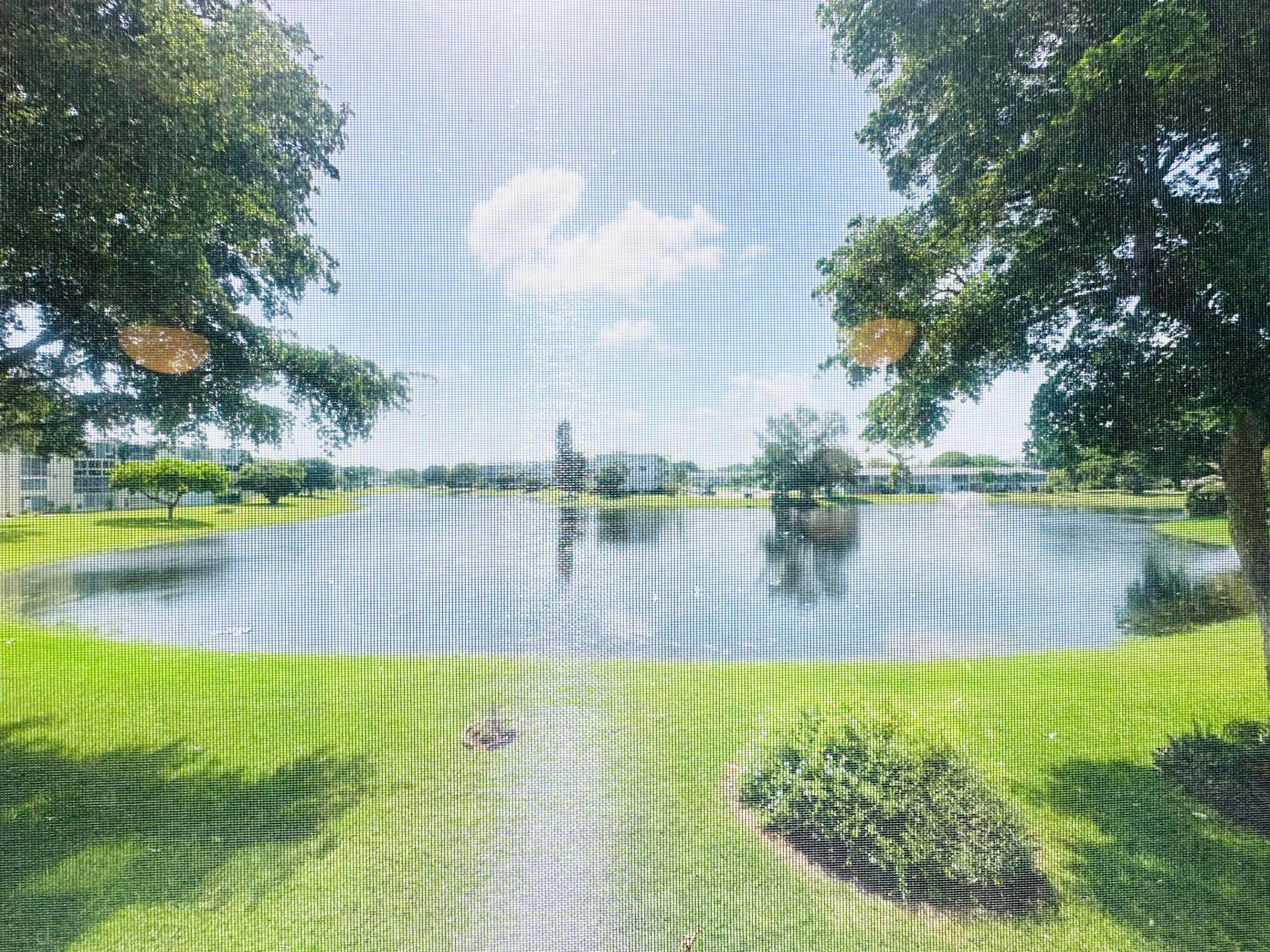 Enjoy peaceful lakefront living in this spacious 2 bdrm, 1.5 bath 2nd fl condo w/a gorgeous LAKE VIEW! This well-maintained, original unit offers a fantastic opportunity to MAKE IT YOUR OWN. The liv areas feature tile flrs, while the bdrms have attractive lam flrs. Addt'l features incl an updated electrical panel, a tub/shower combo in primary bath, 5 ceiling fans thru-out, & a lg encl patio w/sliding glass windows—perfect for relaxing while taking in the beautiful water view.  Residents enjoy a picnic/BBQ area, beautifully maintained grounds, & a peaceful atmosphere. Enjoy this gated comm w/24 security, free busses, pools, tennis, pickleball, Clubhouse w/gym, free Movies, Theater, clubs, classes, Dancing & more. PRICED TO SELL!  DONT MISS THIS ONE!  ASSOC. CLAIMS 55+