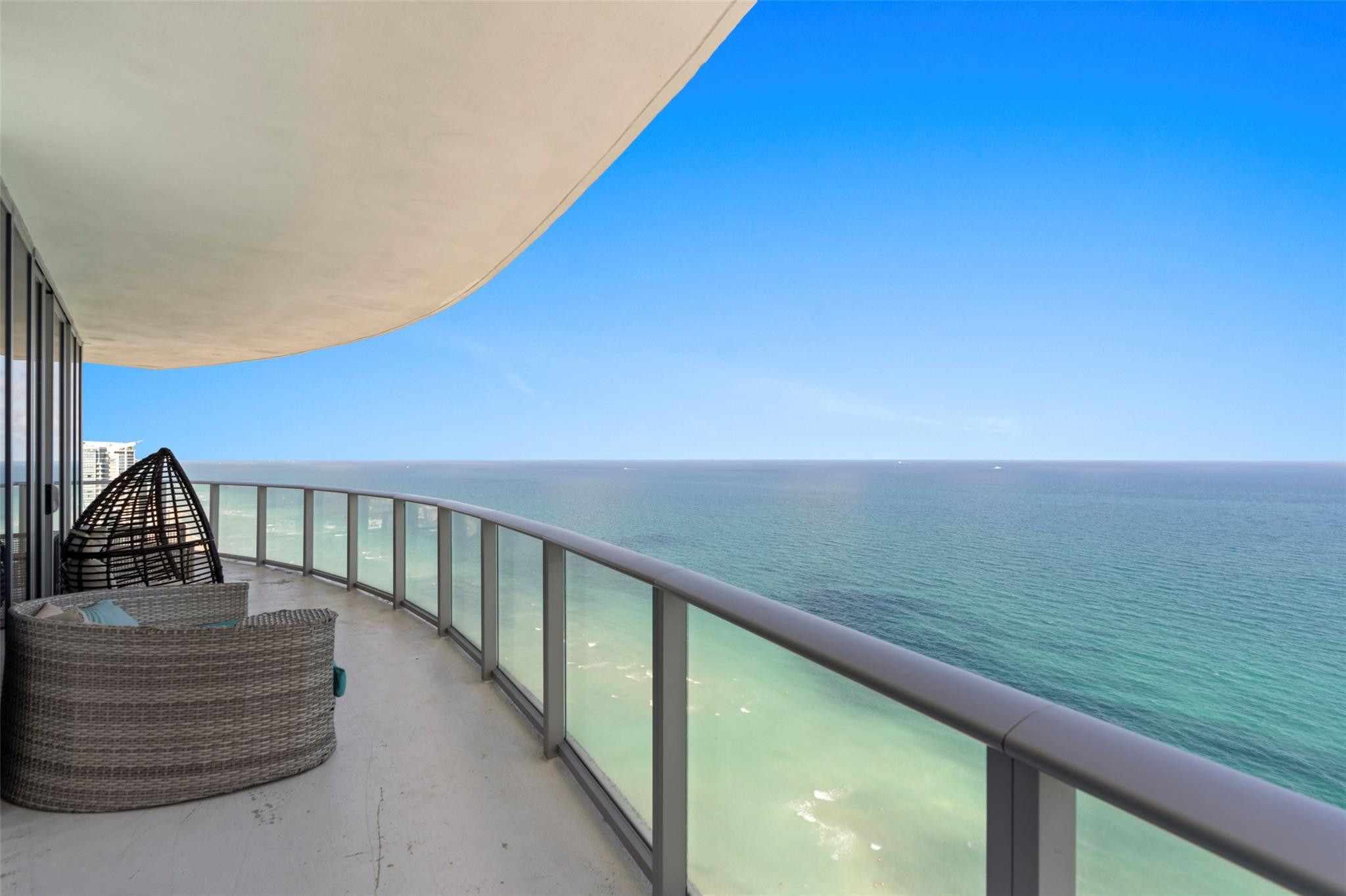 Elevate your lifestyle with luxury and versatility in this Rare oceanfront corner DOUBLE residence (Units 3501 & 3502), one of only five of its kind in the building. This expansive 4-bedroom, 4.5-bath condominium offers stunning panoramic ocean and city views from a generous wraparound balcony. A private elevator foyer opens to a spacious open-concept layout with floor-to-ceiling impact glass and en-suite bathrooms in every bedroom, the property allows short-term rentals with NO RENTAL RESTRICTIONS and no HOA approval required, while also accommodating full-time residence. Resort-style amenities include beach and pool service, spa, fitness center, beauty salon, valet, and on-site dining.