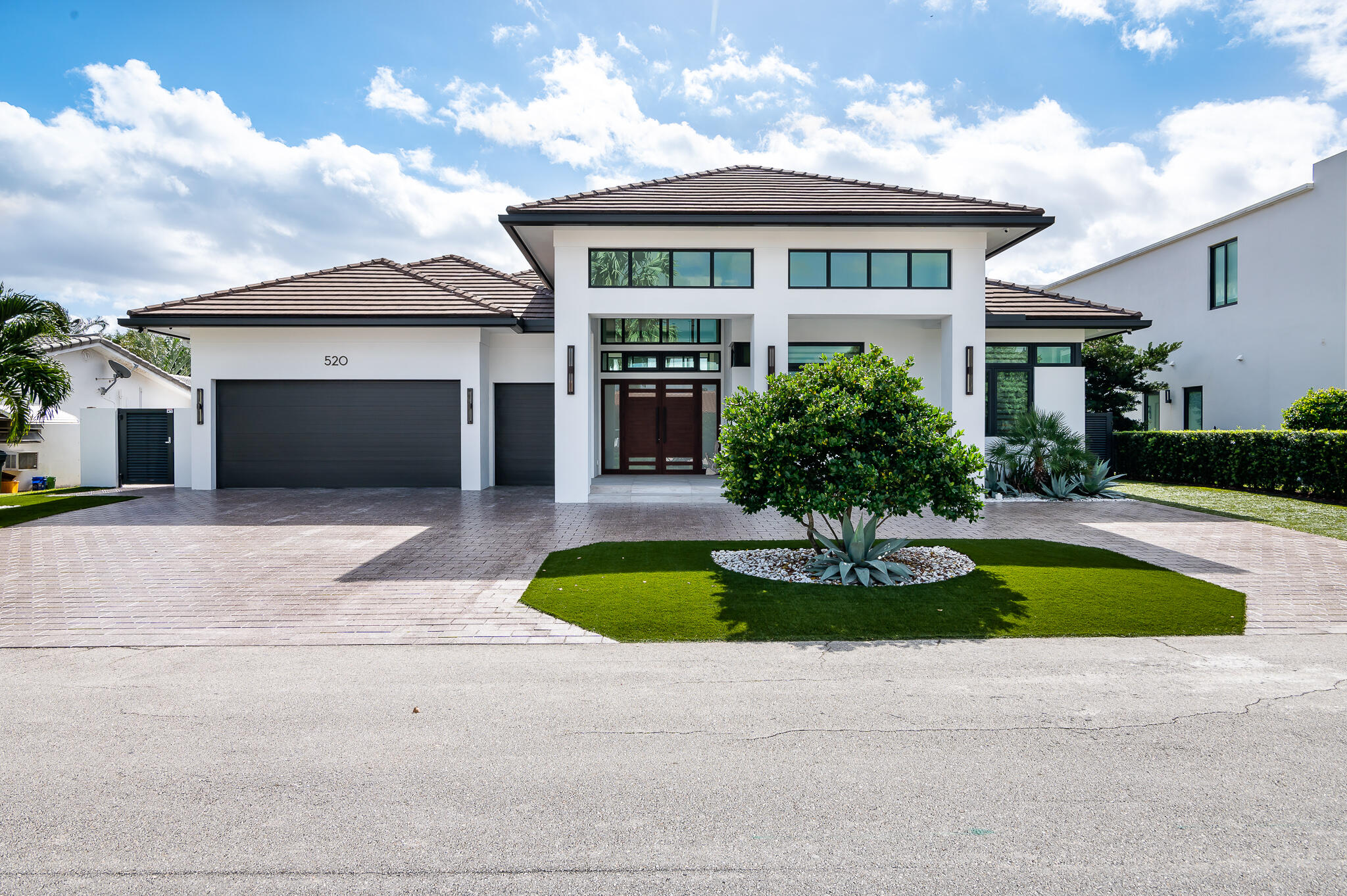With desired southern exposure, this single-story home is located on a deep-water canal in the established neighborhood of Golden Harbour—walking distance to Mizner restaurants, Fifth Avenue shops and the best beaches in Boca Raton. This property is a boater's paradise with 85-feet of waterfront, including a 75-foot dock with 20,000-lbs elevator boat lift. 

Custom built and immaculately maintained, this residence features indoor and outdoor living at its best!  Designed to be maintenance free (by a yachting couple that spends months away from home), it includes Turf grass, 1-touch remote control hurricane screens, custom impact glass and doors, a summer kitchen, and private backyard. With a welcoming front porch, the foyer opens to a great room, bar and modern kitchen that seamlessly extends to an outdoor living room overlooking the waterway.  This residence includes 3 bedrooms, 3 full baths, 1 half bath. Total square footage: 4403 (2788 under air).



Architect: Miklos Architecture
Interior Design: BE Design
Builder: National Custom Homes  built in 2018


16ft ceilings in Entry, Foyer, Living Room and Covered Patio
11ft ceilings in Kitchen, Bedrooms, Bathrooms, Utility and Garage
4x4 imported Italian porcelain tile throughout common areas
2 Air Conditioners 
All Impact windows and doors by SIW
3-car garage, wired for electric vehicle charging 
Large circular driveway, sealed pavers
Turf grass
Outdoor Lighting system, with handcrafted Hubbardton Forge sconces
85ft Batter Pile and Capped seawall
Home automation powered by Samsung Smart Things platform
Custom Boat & Tackle room with outside shower

Great Room:
Custom architectural ceilings
Three architectural chandeliers
Built-in "floating" cabinetry by Neff
Built-in 75" Samsung TV 
Integrated Sonos sound system 
Display wall with architectural niches for artwork
Impact accordion doors that open to outdoor living room

Wet bar:
Bar counter area with custom cabinetry by Neff
U-Line ice maker
Stainless Sink
Display shelving with custom lighting


Kitchen:
Custom cabinetry by Neff 
Thermador 24" Column Freezer 
Thermador 24" Column Refrigerator
Miele Convection Oven and Microwave
Miele Combi Steam and Convection Oven
Miele Wine Refrigerator
Miele Dishwasher
Pompeii quartz countertops and waterfall edge
Custom glass backsplash 
Coffered ceilings with built-in lighting 
Ample cabinet storage
Built-in appliance garages
Rollout drawers within all floor to ceiling cabinetry
Breakfast area overlooking the water

Pantry Rooms: 
Large walk-in primary pantry 
LG Washer  front loading on pedestal 
LG Steam Dryer  front loading on pedestal
Prep/Utility sink 
Secondary walk-in pantry with buffet server 

Powder room:
Built-in cabinetry by Neff
Quartz countertop
Framed designed mirror with lighting
Custom decorative mural wall

Bedroom suite #1:
Modern ceiling fan
Custom window treatment, with remote control
Walk-in closet with custom shelving
Full length mirror
Private bathroom suite with custom cabinetry by Neff
Decorative wall sconces
Walk-in shower, floor-to-ceiling tile
Frameless glass door

Bedroom suite/office #2:
Modern ceiling fan
Custom window treatment, with remote control
Double-door closet with built-in cabinetry
Private bathroom suite with custom cabinetry by Neff 
Marble flooring
Decorative wall sconces
Walk-in shower, floor-to-ceiling tile
Frameless glass door

Master Suite: 
Private foyer
Windows overlook intracoastal
Custom blackout shades on remote, integrated in ceiling
Walk-in closet with custom shelving
2nd Walk-in closet with private entrance 

Master Bathroom:
Separate dual vanities, each with deep sink
Custom cabinetry by Neff
Floor-to-ceiling linen closet
Separate water closet
Massive walk-in marble shower with bench
Dual control shower heads plus a third handheld sprayer

Outdoor Kitchen
42" Windcrest Hood
32" Natural Gas Summerset Grill with separate 12" side burner
13" Stainless Steel Sink
Granite countertop
Custom cabinetry by Neff


Outdoor Dining Room:
Custom all-weather ceiling fan
Large entertaining space with room for a table that seats 10
Impact accordion doors that open to the kitchen
Fully enclosed by Category 5 Armor Screen (1-touch remote control) for hurricane protection

Outdoor Living Room:
Custom all-weather ceiling fan
Feature wall with floor-to-ceiling granite and lighting
Built-in gas fireplace, includes custom lighting features
Built-in 75" Samsung TV
Large entertaining space with room for furniture that seats 10
Fully enclosed by Category 5 Armor Screen (1-touch remote control) for hurricane protection

Dock Space:
10' x 75' custom designed dock with marine composite TanDeck boards
Neptune 20,000 Direct Drive Aluminum Elevator Boat Lift with upgrade to G3 High Speed
Shore power pedestal with 50 amp, 30 amp and 120v outlets
West side of house has unobstructed access to dock/yacht from street - 10ft wide gate with specialized turf embedded with concrete to allow for trucks, boat trailers, dockside refueling
Outdoor shower

Not included in sale price:  Intrepid 323 Cuddy Center Console Boat; 15ft Boston Whaler; Jet Dock