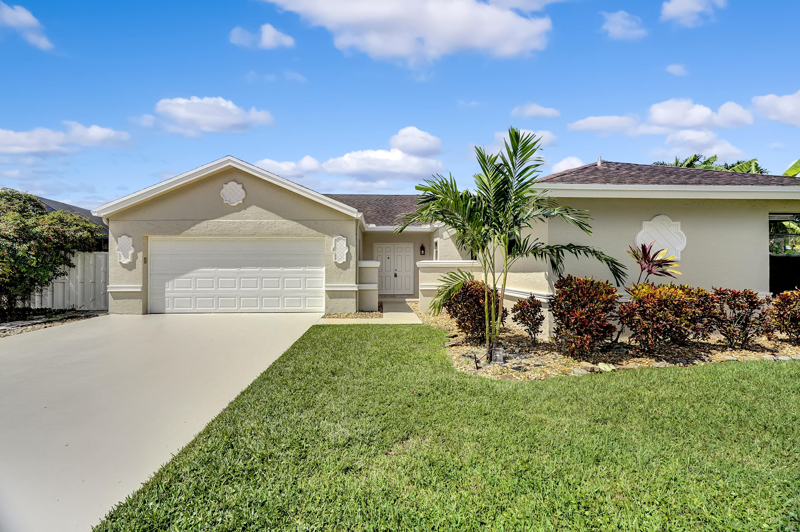 Great cul-de-sac home on lake with pool. Freshly painted inside 3 bedrooms 2.5 bath + bonus living space home for rent in sought after West Boca - Country Landings Estates in Loggers Run. 1680+ sq feet. Single story open concept living area with upgraded white cabinet kitchen: granite countertops, stainless steel appliances, kitchen island, and plenty of storage. Master bedroom has 2 spacious walk-in closets & renovated master bathroom. New floors in all bedrooms. Landscaping is beautifully done with an electronic sprinkler system. Garage has been converted to extra living space, but still space for storage, bikes, etc... Additional outside shed for storage. Fenced backyard and lanai with pool & spacious patio for entertaining. Move in ASAP no approval.