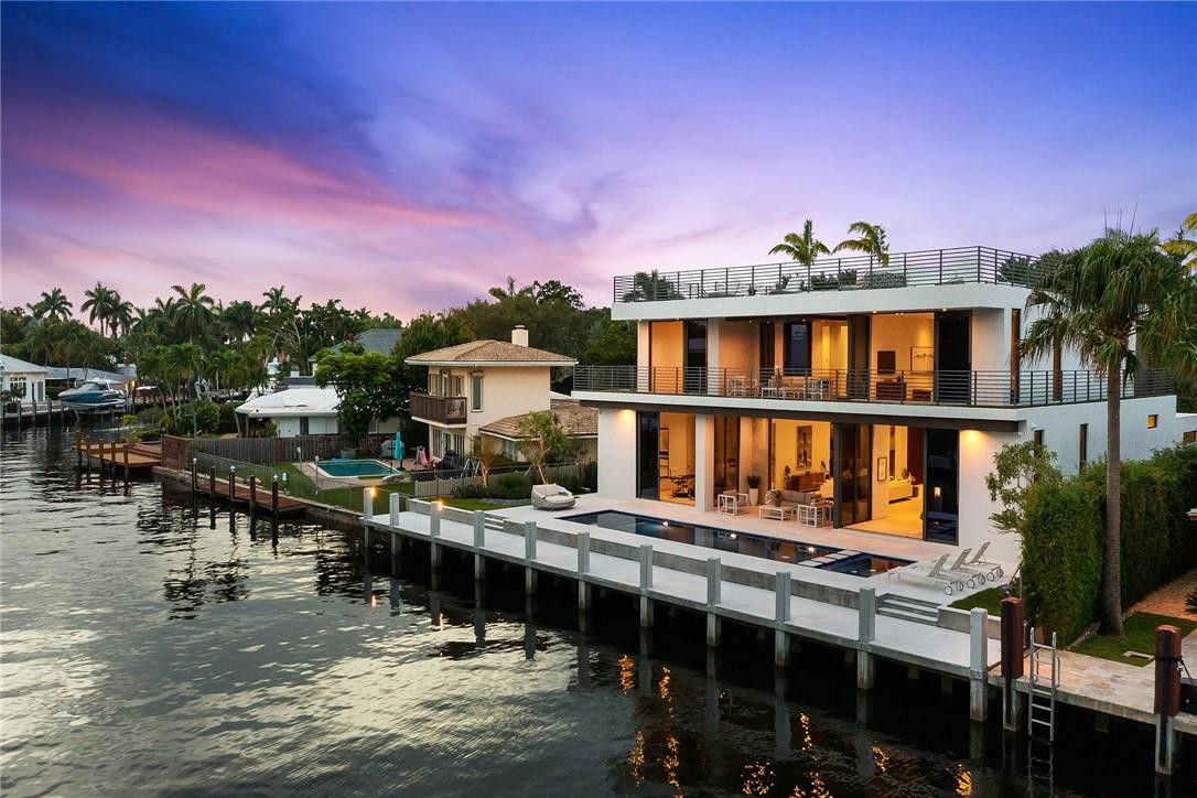Stunning new construction in sought-after Seven Isles with 97' of deep water, ocean access. Breathtaking 35' foyer entry to spectacular water and sparkling pool views. The soaring 12' first-level ceilings and sliding glass doors allow for a light filled, open floorplan in this stunning contemporary residence. Designer details abound with custom walnut accents. Thermador appliances in the chef's kitchen, porcelain and wood flooring, 2 laundry rooms, elevator. Endless outdoor entertaining/living space with 2nd level wraparound terrace and AMAZING 3000 SF roof top terrace with unparalleled city and beach views. Located in the heart of Las Olas, close proximity to beach, shopping and dining on the Boulevard!