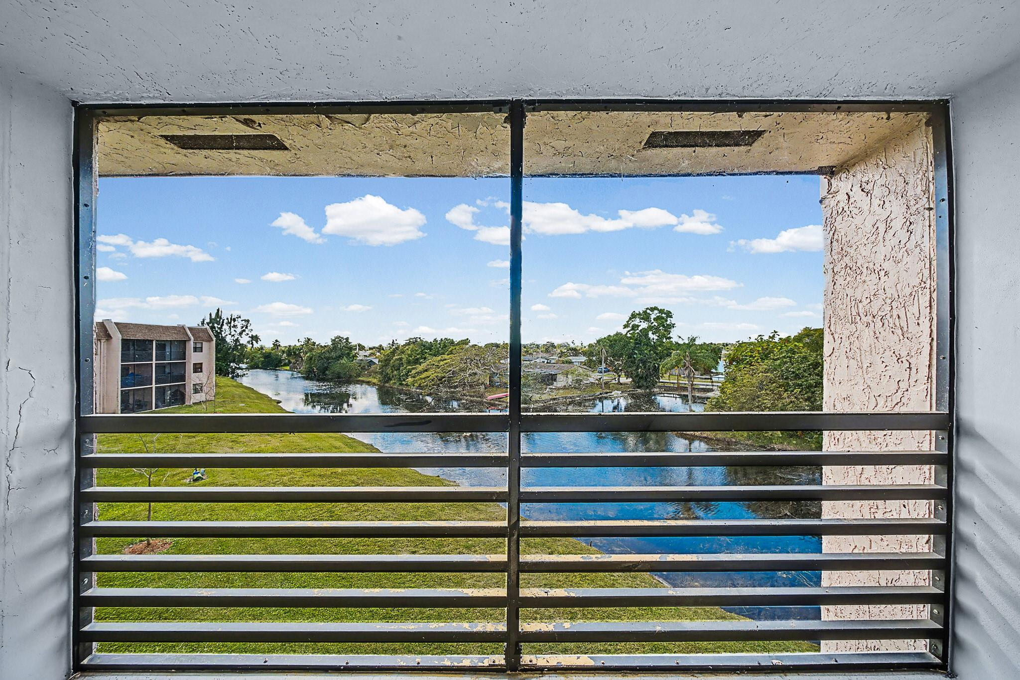 Beautifully priced corner-unit 2-bedroom, 2-bath condo in the highly desirable Sunrise Lakes 55+ community, Step outside onto your balcony overlooking the lake, perfect for morning coffee or sunset relaxation in true South Florida style. The bright open 850 sq ft layout includes a spacious living and dining area ideal for entertaining or relaxing, generously sized bedrooms, and ample storage throughout with great natural light. Resort-style amenities include pools, clubhouse, and fitness center. Conveniently located near shopping, dining, medical facilities, and major highways.Ideal as a full-time residence or seasonal retreat. Motivated seller — priced to sell. Easy to show!