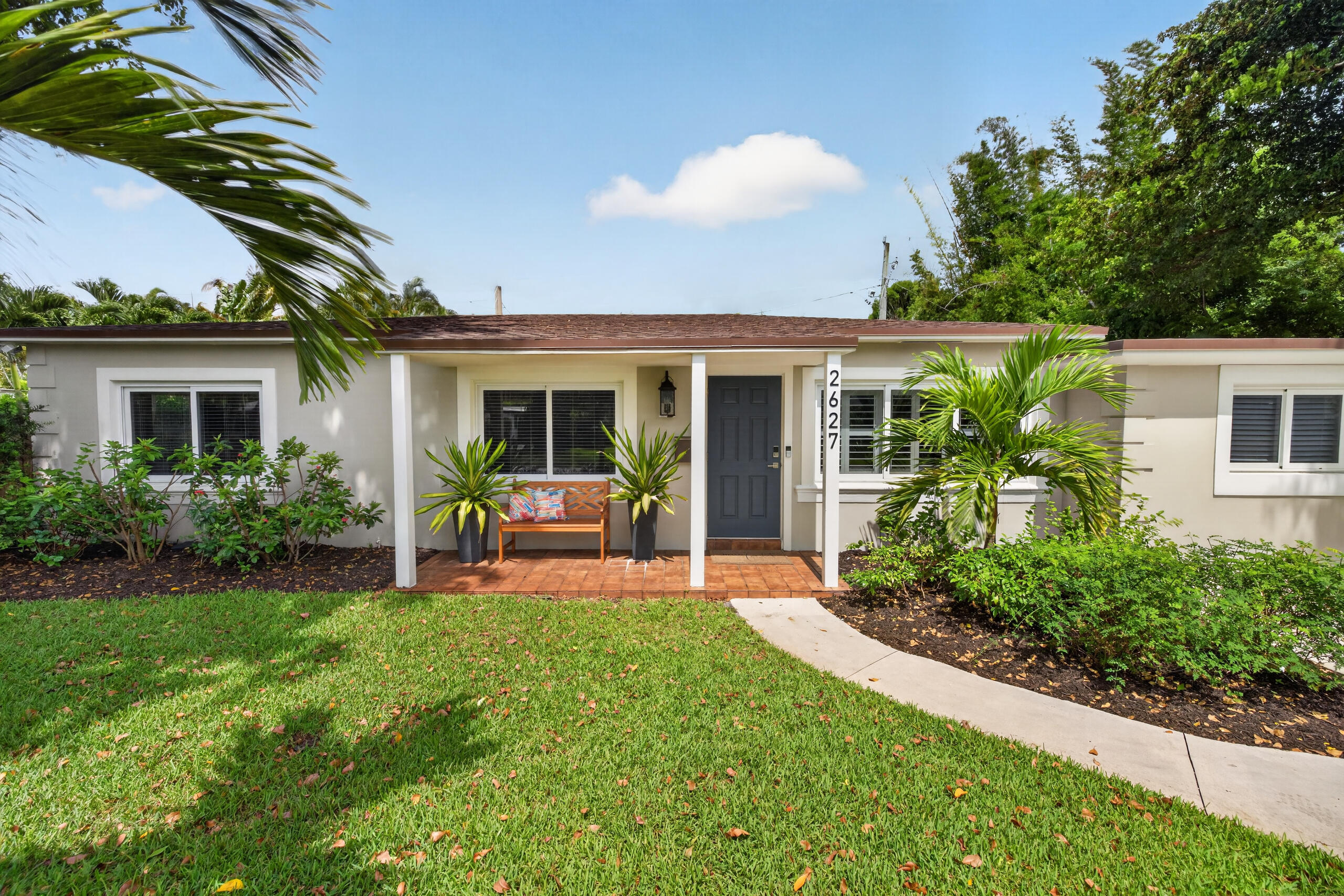 Spacious home with an open floor plan in the heart of Wilton Manors, just moments from the area's dining, shopping, entertainment, and nightlife. This well-maintained residence offers large living and dining areas that can be used in multiple layouts and arrangements to suit practically any furniture style. Features include refinished terrazzo and tile flooring throughout, impact windows and doors, and a new roof (Spring 2025). The kitchen offers beautiful countertops, stainless steel appliances, under-cabinet lighting, and abundant cabinet space. The bathrooms feature modern finishes and functionality. The generous living room and entertaining area includes a wet bar with a built-in beverage cooler and plenty of natural light. The versatile fourth bedroom is situated away from the main living areas and other bedrooms, making it an ideal home office, guest suite, private retreat, arts and crafts room, or potential studio rental. This space features its own private exterior entrance, mini-split air conditioning system, and attached full bathroom for added comfort and convenience. Additional features include a tankless water heater, indoor utility closet with washer and dryer, closet organization systems, an automatic sprinkler system supplied by well water, and a spacious landscaped lot with ample room for a pool. The large paver patio provides the perfect setting for outdoor entertaining or relaxing. Move-in ready and ideally located, this home offers comfort, flexibility, and the prime location in the sought-after City of Wilton Manors.
