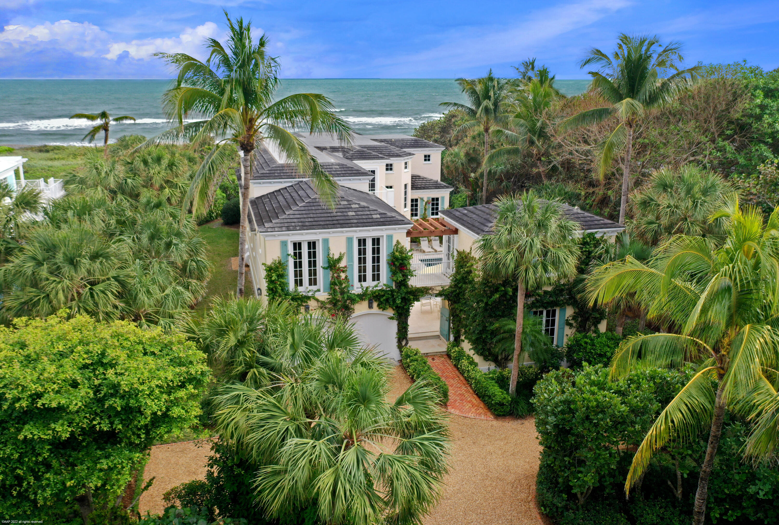 15 N Beach Road on Jupiter Island is the perfect family compound. Sitting on almost an acre of DIRECT OCEAN FRONTAGE with wide ocean views of the turquoise Atlantic gulf stream, this spacious house offers 7 bedrooms and multiple, expansive outdoor spaces for relaxing and entertaining on the east and west sides. The heated pool and spa connect the main house to the cabana which includes a sitting room, bedroom and bath. Convenient location close to Bridge Road provides quick access to mainland restaurants and services.