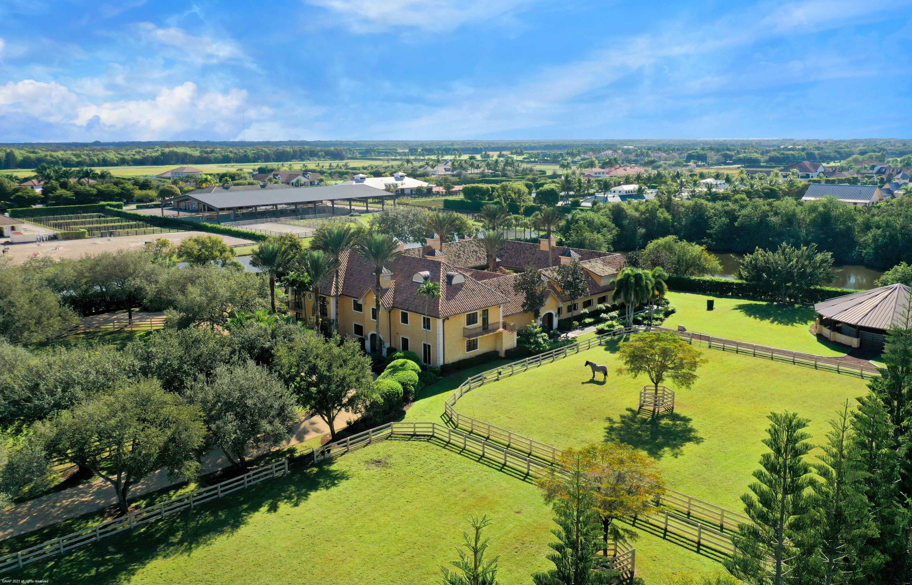 Offered for sale for the first time. This is your opportunity to own one of the biggest farms in Grand Prix Village. This absolutely stunning facility has mature landscaping and ultimate privacy, with 3 gated entrances and security cameras throughout the property. Consisting of 3 parcels totaling 14.15 acres and located a mere 2/10ths of a mile to PBIEC showgrounds. No detail has been overlooked in this beautifully custom created farm. The main courtyard barn with 20 matted, Loddon stalls provides a comfortable, peaceful environment for your horses. Thoughtfully laid out 10 bedroom staff housing including a separate managers apartment. Horse amenities include: a 60' covered walker, a 150'x250' Bermuda mix grass jumping field and a 120'x270' sand arena with exceptional drainage. SEE MORE>> There is a separate, spacious 7 stall barn that is currently being used for storage, but can easily be converted back. Above, you'll find a 3 bedroom/3 bathroom penthouse with each bedroom having its own balcony. 

DISCLAIMER: All information provided to you regarding this Property by Realtor and her associates has been obtained from third parties such as the Multiple Listing Service, public records and other sources. All Buyers should independently verify all information provided regarding this Property. The Sellers, Realtor and Broker make no representation as to the accuracy of this information. All Buyers should perform their own independent due diligence regarding this Property before executing a Contract for Sale and Purchase for this Property.