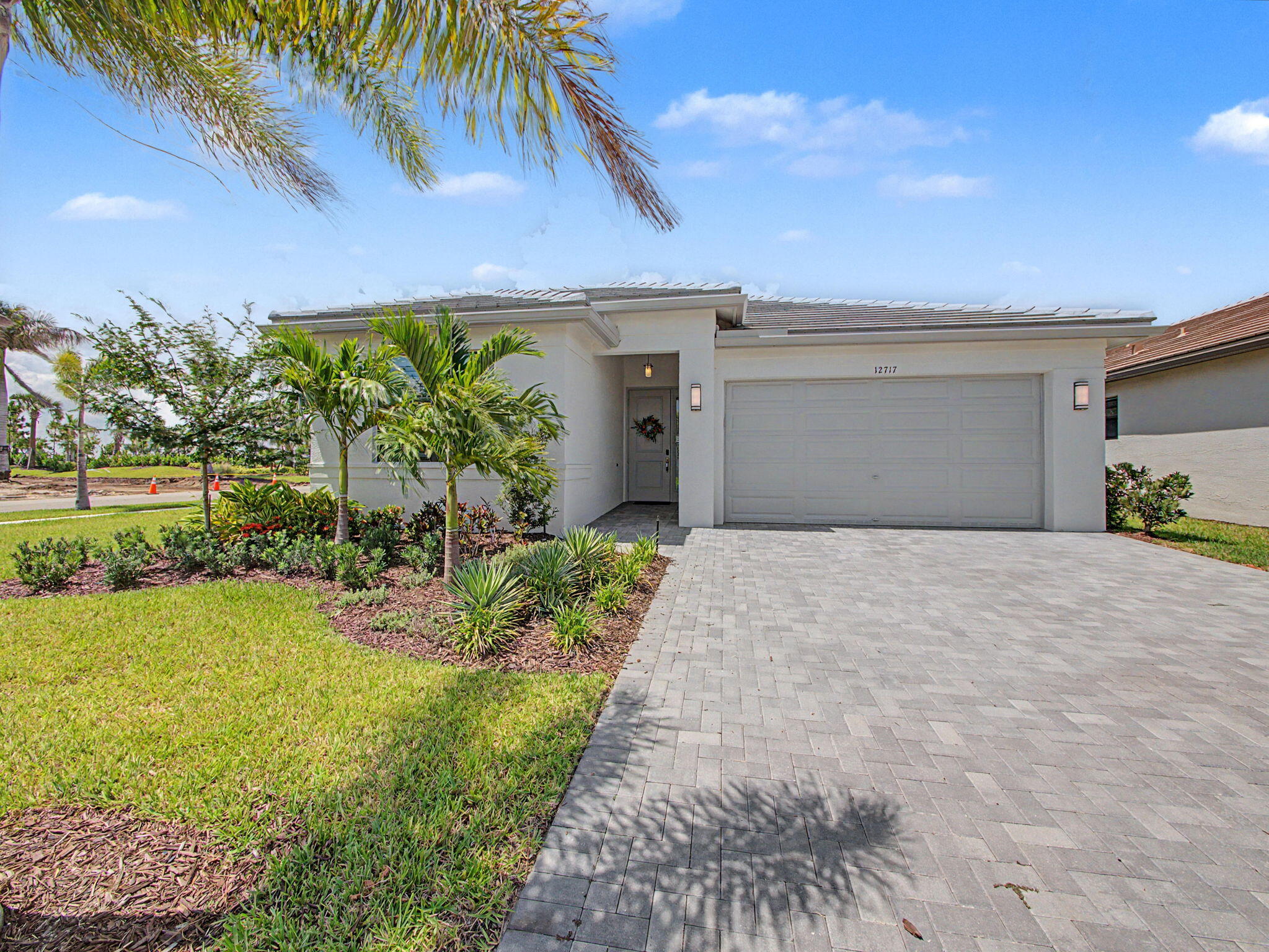 If you are hoping for an upgraded Sandpiper model on a huge corner lot this is the stunning option you've waited for! So close you can walk to all your favorite Sunday Fundays at the Clubhouse and Sunset Grille! This truly one of a kind home includes luxury upgraded tile flooring. Gorgeous kitchen with striking granite and stainless appliances. Pull out shelving throughout the kitchen with pots and pan drawer, custom pantry. Stunning built in Bar in living room with elegant finishes, lighting, wine fridge. Each bath has been thoughtfully designed for elegance with upgraded seamless glass, custom shower heads and mirrors to the ceiling. Plantation shutters, pockets door everywhere available, extended screened in lanai, beautifully landscaped private backyard with berm.  Built in speakers on den ceiling help to elevate your experience entertaining guests or watching movies.  A custom laundry room with Shiplap design with laundry sink, and built-in cabinets, complete custom cabinets in the master closet, Alini water system, impact windows, a 220 outlet installed and ready for you in the garage with double the storage with both tandem and drop down space, Polysporic flooring. You'll love the unique features in every room with each having designer touches that elevate the entire space. This property has been meticulously maintained and ready for to you to move right in! Valencia Parc at Riverland Clubhouse is now complete and ready for you to enjoy!  This 38,000-square foot Clubhouse has resort-style amenities including the newest Riverland Restaurant, the Sunset Grille. Enjoy the 24-acre Sports & Racquet Club with more than 80 outdoor sport courts and a newly renovated Wellness & Fitness Center. If Art and creativity is your vibe express it at the Arts and Culture Center where you can create fine food, ceramics or simply plant your favorite flowers! Be sure to bring your golf cart and enjoy the Paseo and greenways that connects the amenities directly to each neighborhood throughout Riverland. Move for the lifestyle...it is truly like no other!