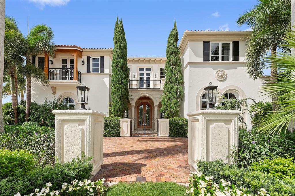 101 Ft waterfront. This stunning Palm Beach style estate is situated on a prime waterfront corner lot on one the most exclusive streets in Royal Palm Yacht & Country Club. Elegant details include high ceilings, exquisite moldings, and extraordinary stone inlaid flooring. The residence features 6 bedrooms, 8.1 baths, custom paneled elevator, impact glass windows and doors, 4-car garage plus golf cart bay. Gracious entertaining is assisted with a butlers pantry, wine room, and newly refinished white chef's kitchen. Resort style pool/ patio with summer kitchen and approximately 101 feet of yacht dockage.