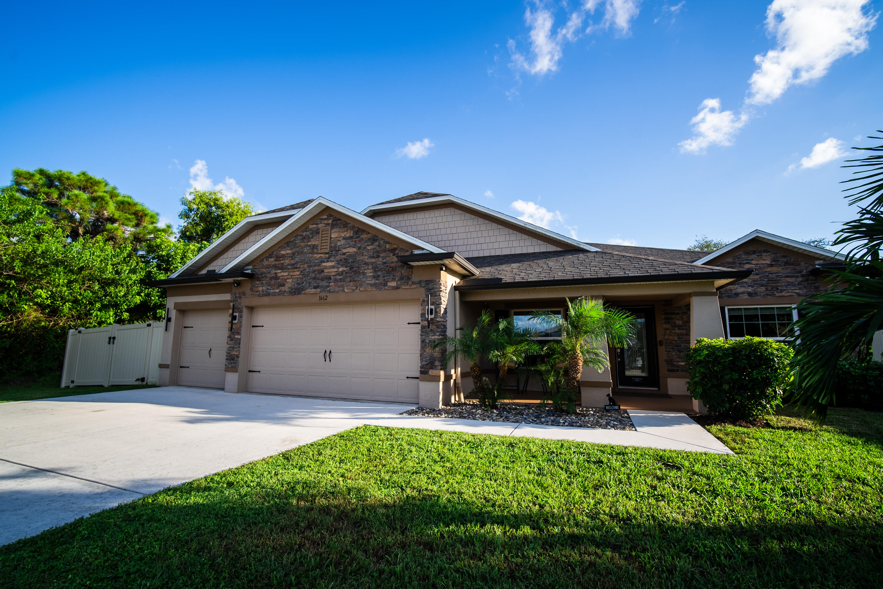 Beautifully upgraded 2019 CBS home on a canal lot with no HOA, no carpet, and an East-of-US-1 location.  |  Features include a 3-car garage, hot-tub spa, fully fenced yard, boat/RV parking, chef's kitchen, tile throughout, and close proximity to beaches, boating, dining, and shopping.  |  Now priced below recent appraised value, offering buyers an opportunity for immediate equity!  |  Seller is offering a $2,500 buyers concession at closing with an acceptable offer.  Welcome to this clean, pristine, and beautifully upgraded Maronda Sierra Plan offering 4 bedrooms, 3 bathrooms, and a flex space room.  |  Built in 2019 with solid CBS construction, this modern traditional home showcases a real stone façade, wrap-around gutters, an extended driveway, and a desirable East-of-US-1 location just minutes from the Intracoastal, beaches, boating, and everyday conveniences.  |  The interior is thoughtfully finished with ceramic tile throughout and zero carpet. The chef's kitchen features granite countertops, a double oven, a sleek glass cooktop, and generous workspace for cooking and entertaining. The spacious primary suite includes an oversized walk-in shower with a rain showerhead, while the ensuite guest bedroom offers an upgraded walk-in shower for added comfort and privacy. Additional highlights include a large laundry room with cabinetry and folding counter, white wood-look blinds, double-pane energy-efficient windows, full hurricane shutters, and a smart home security system.  |  Enjoy exceptional outdoor living from the covered back patio with color-matched electric privacy screens and a relaxing hot-tub spa. The fully fenced yard offers privacy and functionality, including a double gate and a separate fenced area ideal for boat or RV parking. The 3-car garage includes a utility sink, adding convenience for storage, hobbies, and everyday use.  |  Set on a peaceful canal lot near the Green River Parkway Trail and Savannah Preserve, this home offers quick access to downtown Jensen Beach, Stuart, the Treasure Coast Mall, restaurants, entertainment, major roadways, beaches, and boating destinations.  |  Move-in ready, beautifully maintained, and ideally located—this East-of-US-1 home delivers space, upgrades, and Florida lifestyle appeal.