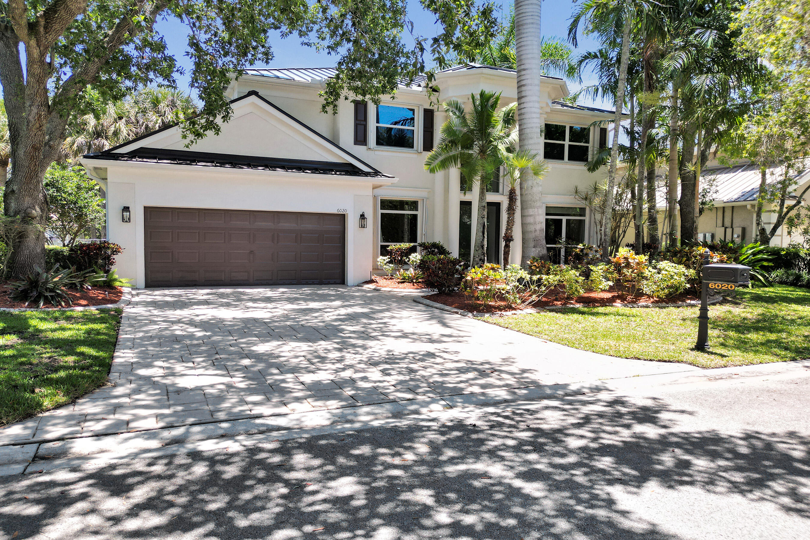 Lakefront home in the prestigious gated community of Water's Edge 1 of the lowest HOA fees in Parkland*This home has been upgraded within the last or year 2 : new roof, new impact windows and doors, renovated kitchen w newer appliances, and a brand new spa-style primary bathroom. other bathrooms w updated cabinetry*hardwood floors throughout the staircase and entire second level*Brand new roof and impact windows mean immediate & significant savings on your insurance*Abundant natural light fills the home perfect for everyday living & entertaining*The 1st floor has a den/bedroom option ideal for a home office or guest suite*Large covered patio overlooking serene lake views*oversized 3-car tandem garage*Zoned for Parkland's A+ schools*Minutes to Pine Trails Park, dining, and shopping The AC is under 5 years old & the water heater is less than 2 years old