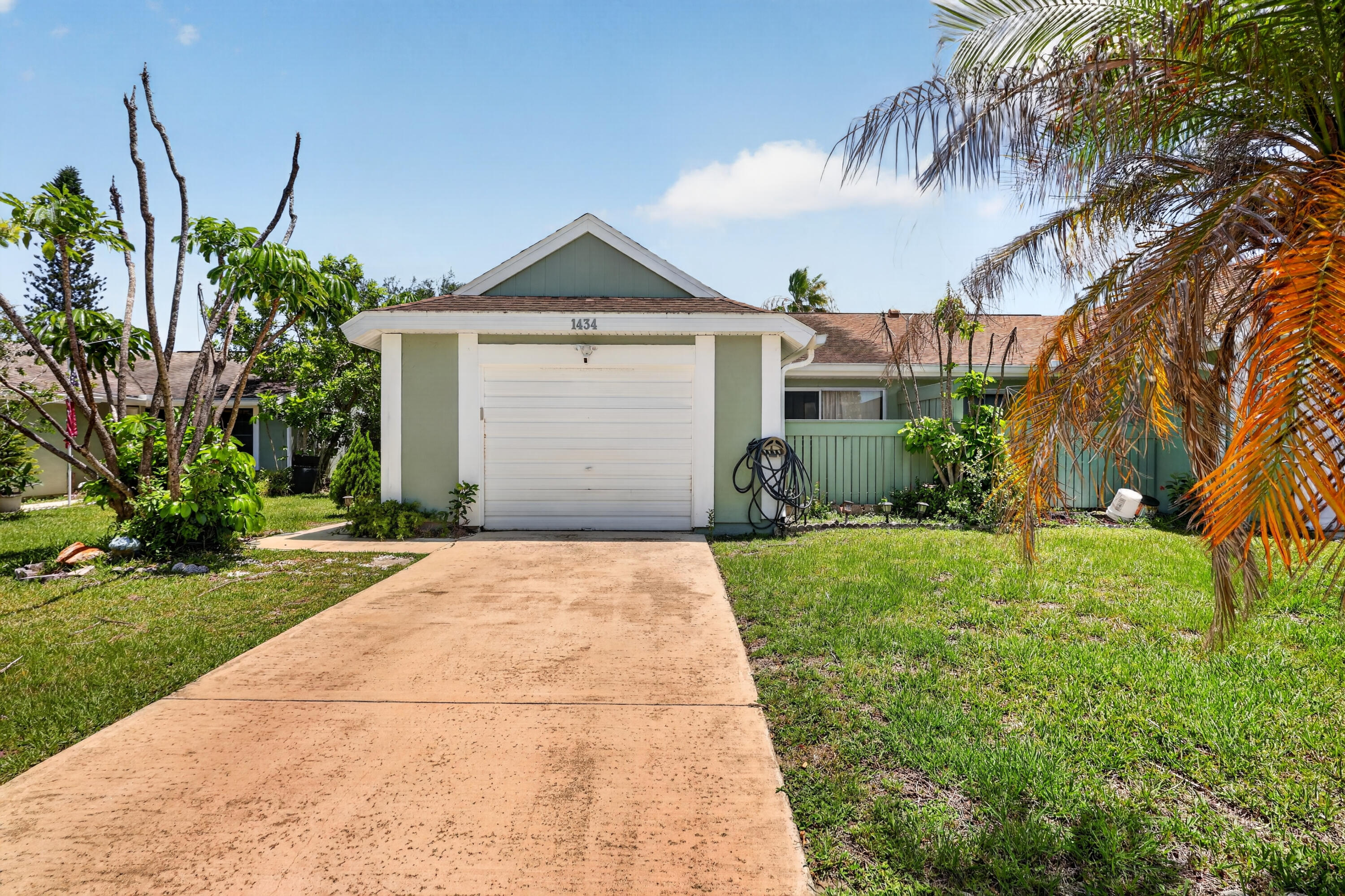 Amazing opportunity to own this spacious and beautifully updated villa featuring modern upgrades and flexible living space.  Perfect for first-time homebuyers, growing families, multi-generational living, or investors seeking a great opportunity. Located in a well-maintained community close to shopping, dining, schools, parks, and beautiful beaches, this property combines convenience, value, and potential. Whether you're looking for a primary residence or an investment property, this villa is a must-see. The home offers an open-concept living and dining area, a screened porch, an enclosed patio off the primary bedroom, and a generously sized laundry area.  Originally designed as a 2 bedroom, 2 bath residence, the home has been fully remodeled, and the attached one-car garage has been converted into two additional bedrooms, creating a functional four-bedroom, two-bath layout ideal for a variety of lifestyles. Easily convert it to a garage if no additional rooms are needed.