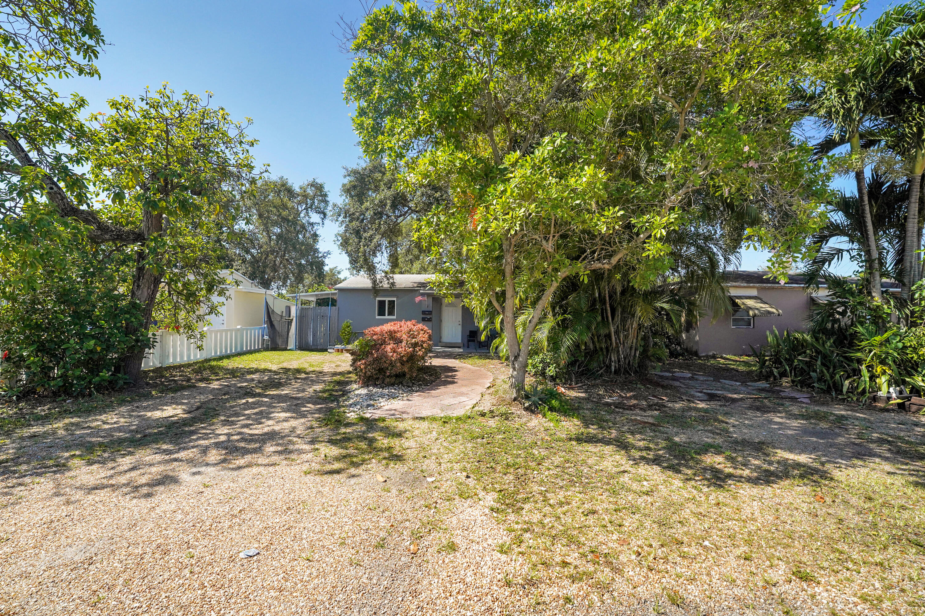 Located on a low traffic street in East Hollywood, this property sits minutes from downtown Hollywood, golden beaches, Ft. Lauderdale International Airport, & the Hard Rock. This triplex features a remodeled 2bed 1bath, a 1bed 1bath, & a detached remodeled studio efficiency with private rear access. New AC's were installed in each unit. Suitable for short term rentals, or long term tenants. Ample parking for up to 6 vehicles, including space for an RV or boat, and sits on elevated ground. Low-maintenance landscaping, an in-ground spa/plunge pool (currently not being used) and an expansive 45-foot deck. Approximately 2,000 sq ft under roof with 1,611 sq ft of living space. Roofs replaced in 2020. Each unit is currently tenant occupied on a month to month basis.