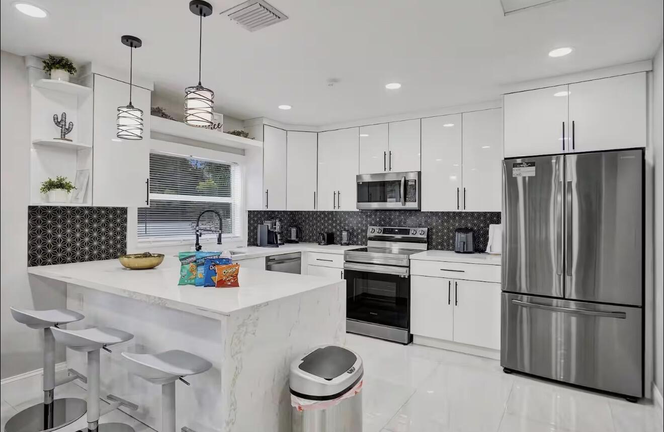 Beautifully renovated 3 bed 2bath home in the heart of Hollywood, FL available for rent. Walking distance to downtown hollywood with tons of bars/restaurants/activities. The property is fully fenced and includes an automatic gate, providing privacy and secure parking for multiple vehicles. Enjoy the spacious backyard and covered patio complete with recessed lighting, outdoor seating, and a BBQ area. Pet-friendly, can be rented furnished or unfurnished. Conveniently located near Jefferson Park, offering tennis courts, padel courts, basketball courts, baseball fields, playgrounds, and green space for recreation. Minutes from Hollywood Beach, shopping, dining, major highways, FLL Airport, and the Brightline station. Exceptional opportunity in Hollywood.