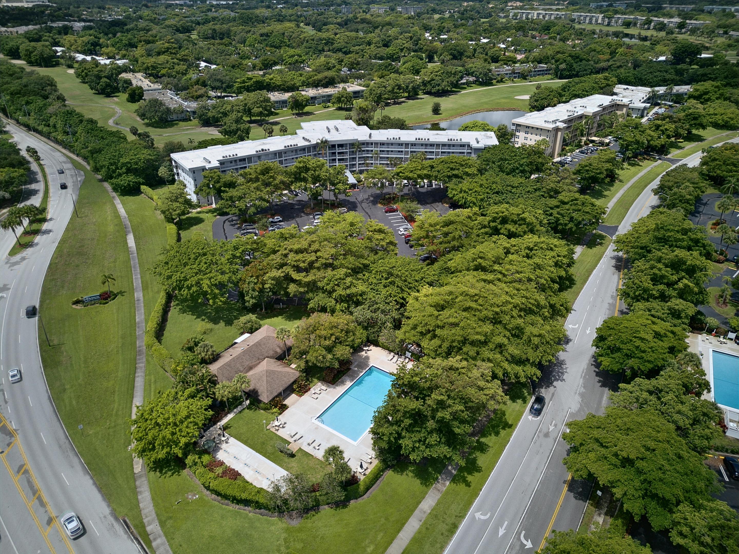 Rarely available KING Model overlooking the Fazio-designed Cypress Golf Course with tranquil lake views and spectacular sunsets. This spacious 3BR/2.5BA first-floor condo offers over 1,800 SF with a split-bedroom floor plan, two oversized screened patios, porcelain flooring throughout, and abundant natural light. The versatile third bedroom is ideal as a den, office, or guest room. No mandatory membership. Furniture negotiable. Well-managed association with fully funded reserves, no assessments, 40-year recertification completed, and a new roof (2025). HOA includes cable, high-speed internet, water, sewer, trash, master insurance, heated pool, clubhouse, and more. Steps to heated pool. Minutes to beaches, shopping, dining, major highways, Wilton Manors, Las Olas.