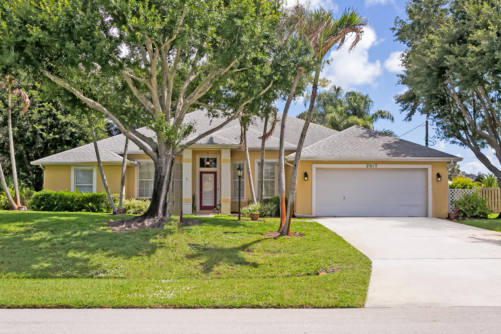 Welcome to Paradise!  Impressive Custom-Built CBS, One Owner, 4 Bedrooms, 3 Full Bathrooms, 2 car Garage on .47 of an Acre of Mature Landscaping with screened in Patio in Sandpiper Bay Community!  Prepare to be Impressed!  Elegant Foyer invites you into the Formal Dining Room, Formal Living Room or spacious Family Room w/ French Doors to Screened Patio.   Tile Flooring throughout main living area.  Spacious Eat-In Kitchen w/ S.S. Appliances, Granite Countertops and Snack Counter. Primary Bedroom, w/ carpeting, features French Doors to Patio w/ spacious Bathroom Suite.  Double Walk-In Closets.  Guest Bedrooms were thoughtfully planned.  2 Bedrooms, w/ carpeting, share a Full Bathroom, the Rear Bedroom, w/ laminate floor, has Full Bathroom w/ access to the Patio Area. *See Broker Remarks.
