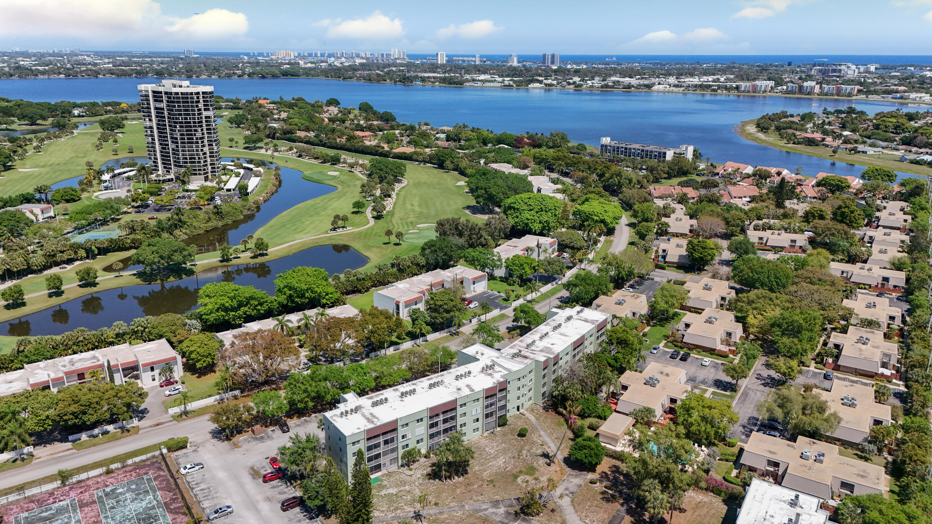 Well maintained 2-bedroom, 2-bath condo located on the second floor of a 4-story building. The unit features updated flooring, fresh interior paint, and refreshed kitchen cabinetry. Bathrooms are in original condition. Screened balcony and hurricane shutters included. Community with no age restrictions. Building amenities include elevator access and shared laundry facilities. Association fee covers water, sewer, and trash. Centrally located with convenient access to shopping, dining, major highways, Palm Beach Outlets, Tri-Rail Station, CityPlace, Palm Beach International Airport, and a short drive to the beaches Partially updated interior. Bright unit with functional layout. Convenient location near major roadways and local amenities