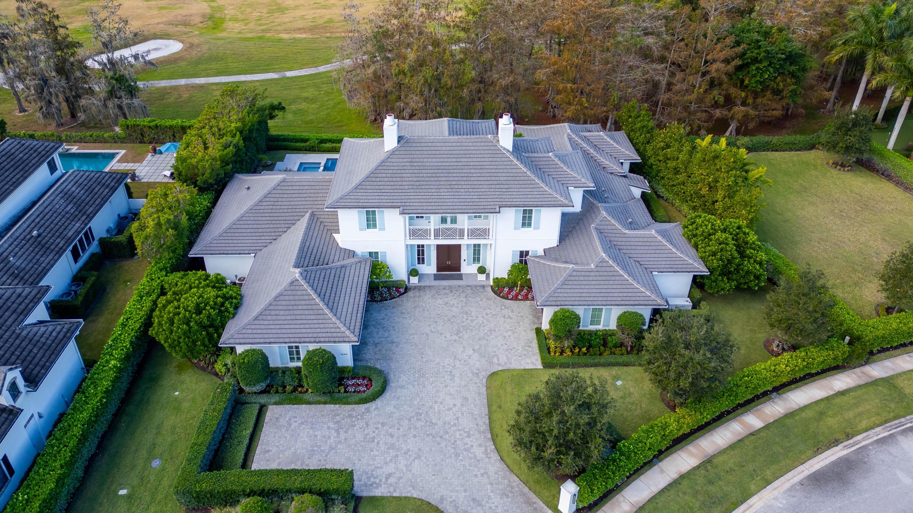 Nestled in the prestigious Blue Cypress neighborhood of Palm Beach Polo & Country Club, this stunning 5-bedroom, 7-bathroom estate offers a rare opportunity on a double lot. With unparalleled luxury and modern living, the property boasts breathtaking golf course views, an open-concept floor plan, a gourmet kitchen, and state-of-the-art smart home technology. Enjoy seamless indoor-outdoor living with a pool, outdoor kitchen, and spacious entertaining areas. Additional highlights include a private elevator, impact windows, a home generator, and a 3-car garage. Perfectly crafted for both comfort and sophistication, this property is your dream oasis.